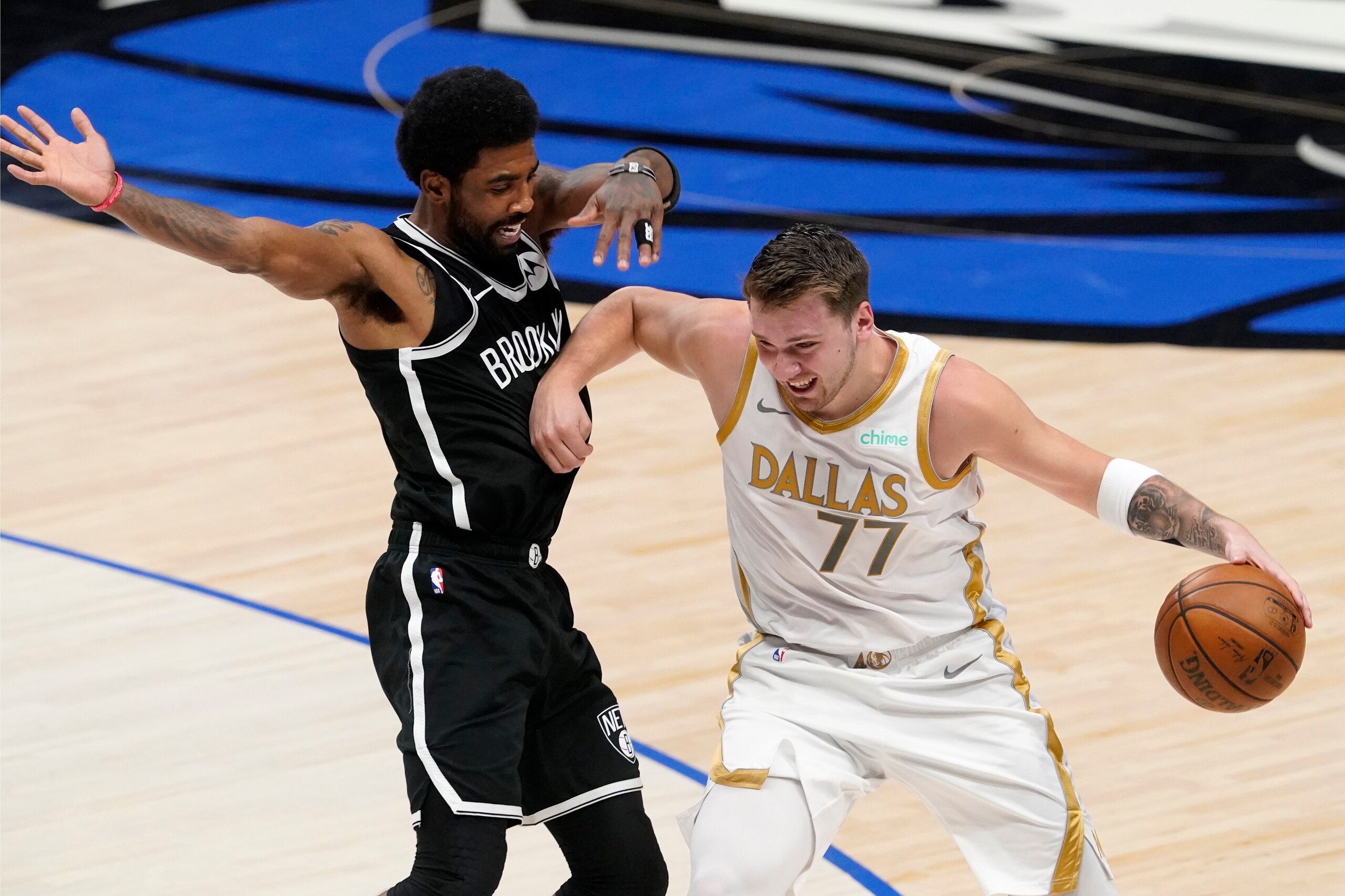 Brooklyn Nets' Kyrie Irving (11) defends as Dallas Mavericks guard Luka Doncic (77) advances the ball upcourt in the first half of an NBA basketball game in Dallas, Thursday, May 6, 2021. (AP Photo/Tony Gutierrez) Brooklyn Nets' Kyrie Irving (11) defends as Dallas Mavericks guard Luka Doncic (77) advances the ball upcourt in the first half of an NBA basketball game in Dallas, Thursday, May 6, 2021. (AP Photo/Tony Gutierrez)