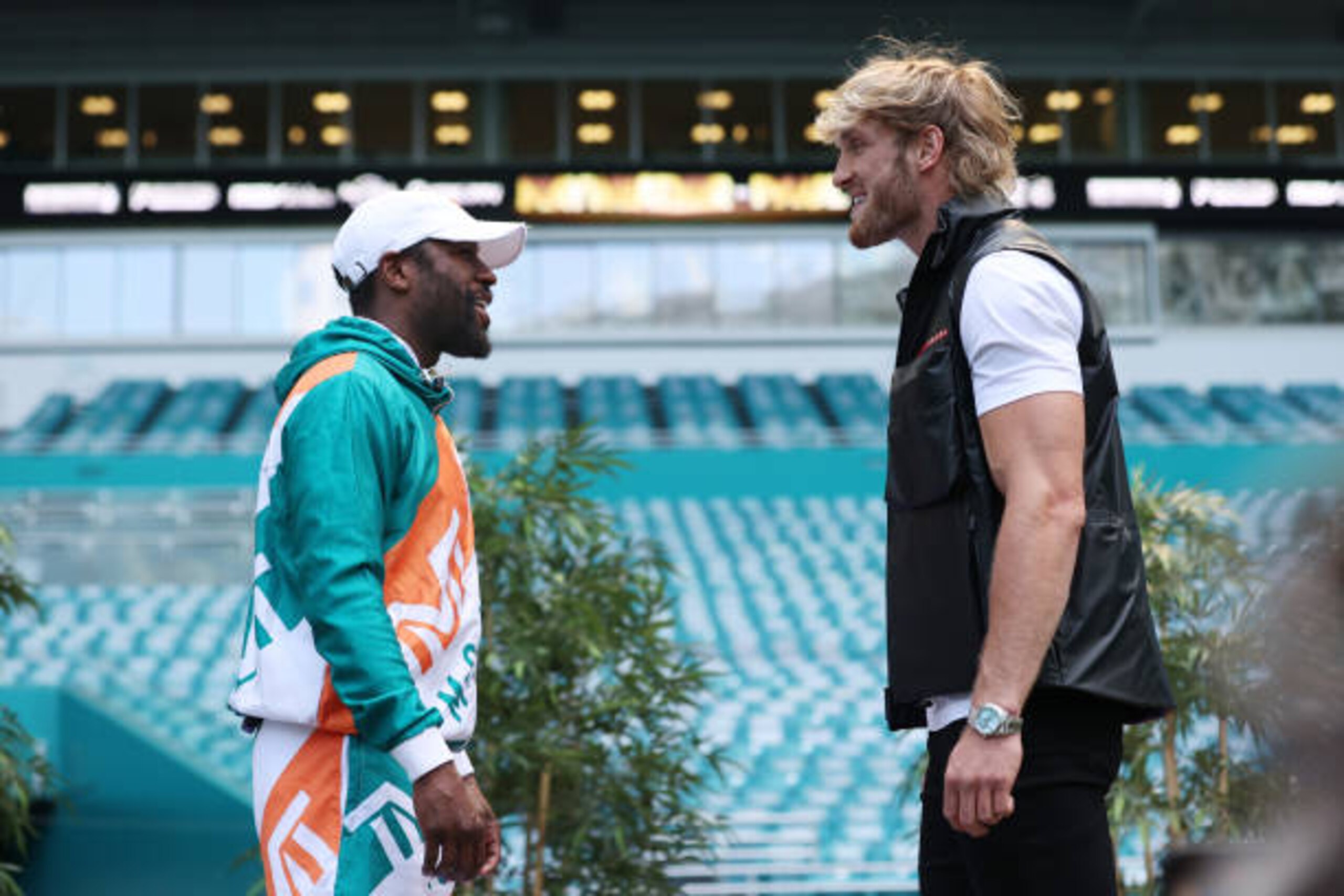 MIAMI GARDENS, FLORIDA - MAY 06:  Floyd Mayweather and Logan Paul face off during media availability prior to their June 6 match at Hard Rock Stadium on May 06, 2021 in Miami Gardens, Florida. (Photo by Cliff Hawkins/Getty Images)