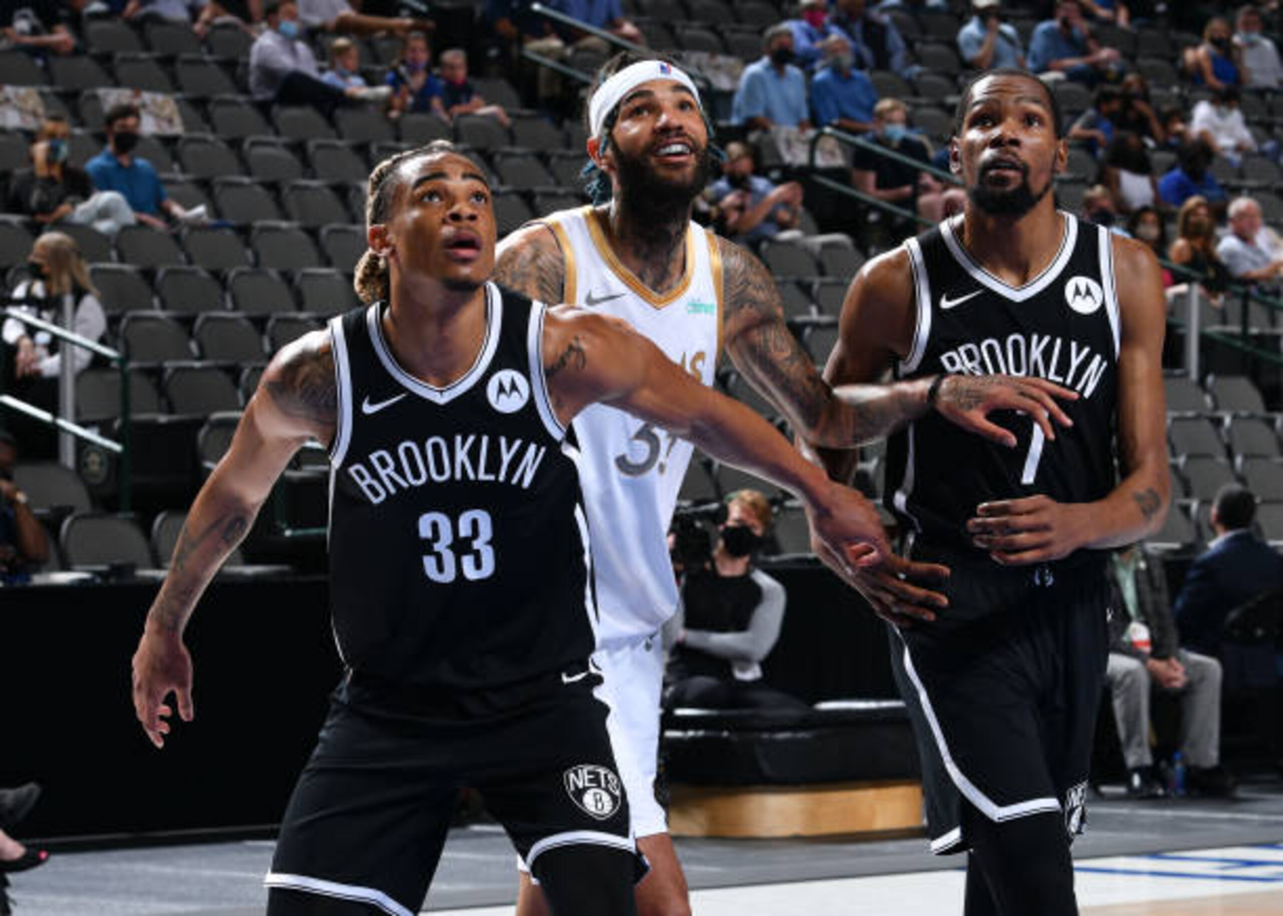 DALLAS, TX - MAY 6: Nicolas Claxton #33 and Kevin Durant #7 of the Brooklyn Nets and Willie Cauley-Stein #33 of the Dallas Mavericks look on during the game on May 6, 2021 at the American Airlines Center in Dallas, Texas. NOTE TO USER: User expressly acknowledges and agrees that, by downloading and or using this photograph, User is consenting to the terms and conditions of the Getty Images License Agreement. Mandatory Copyright Notice: Copyright 2021 NBAE (Photo by Glenn James/NBAE via Getty Images)