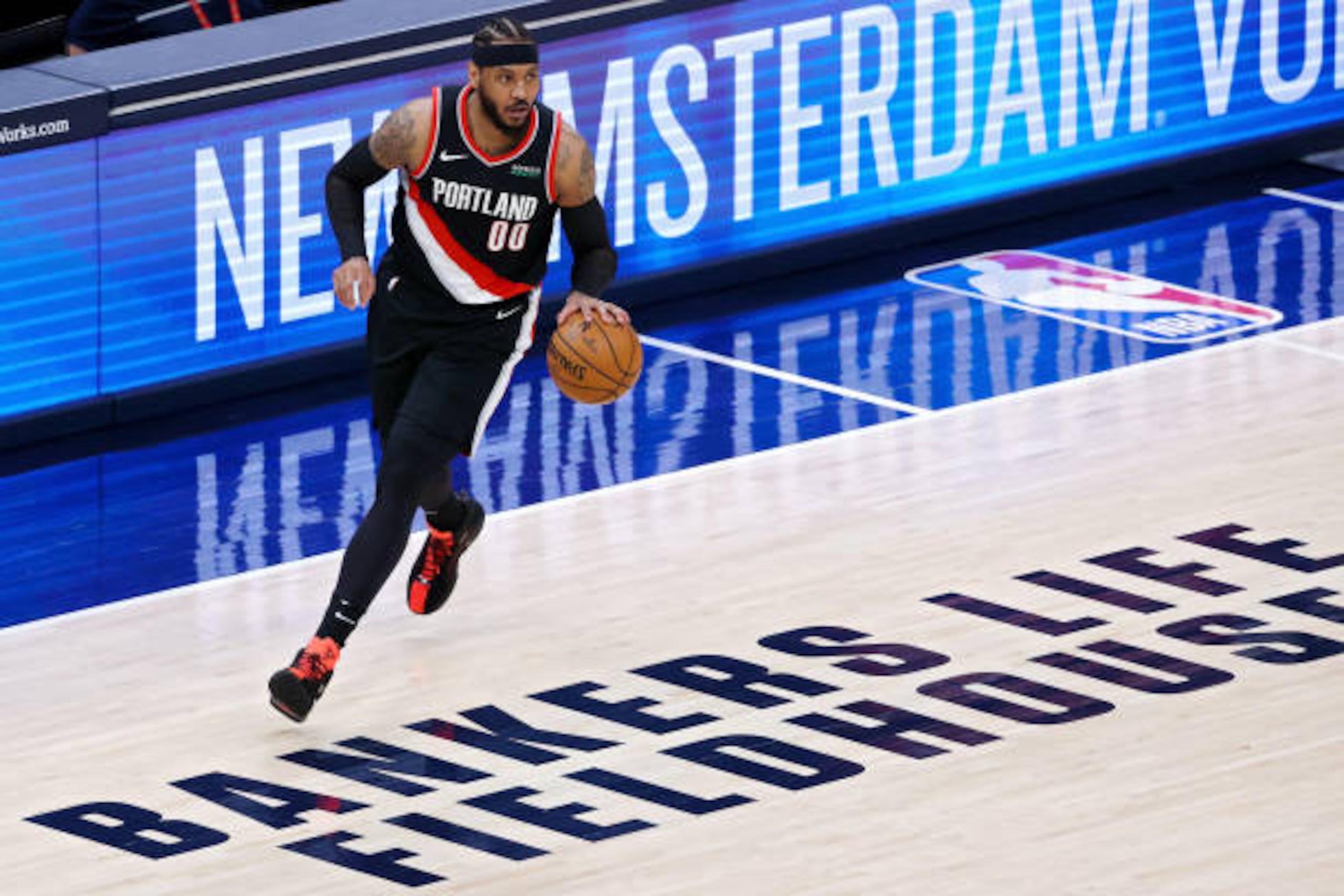 INDIANAPOLIS, INDIANA - APRIL 27: Carmelo Anthony #00 of the Portland Trail Blazers dribbles the ball in the third quarter against the Indiana Pacers at Bankers Life Fieldhouse on April 27, 2021 in Indianapolis, Indiana. NOTE TO USER: User expressly acknowledges and agrees that, by downloading and or using this photograph, User is consenting to the terms and conditions of the Getty Images License Agreement. (Photo by Dylan Buell/Getty Images)