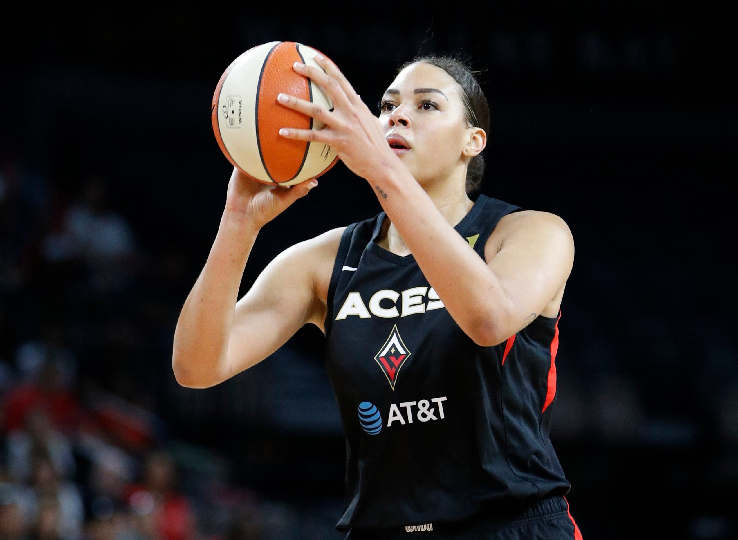 FILE - In this Sept. 24, 2019, file photo, Las Vegas Aces' Liz Cambage (8) plays against the Washington Mystics during the first half of Game 4 of a WNBA playoff basketball series in Las Vegas. Cambage started a GoFundMe page to raise money to help after fires that have devastated her native Australia. The money raised will be divided and distributed equally between many groups, including the Australian Red Cross Disaster Recovery and Relief and World Wildlife Foundation Australia. (AP Photo/John Locher, File)