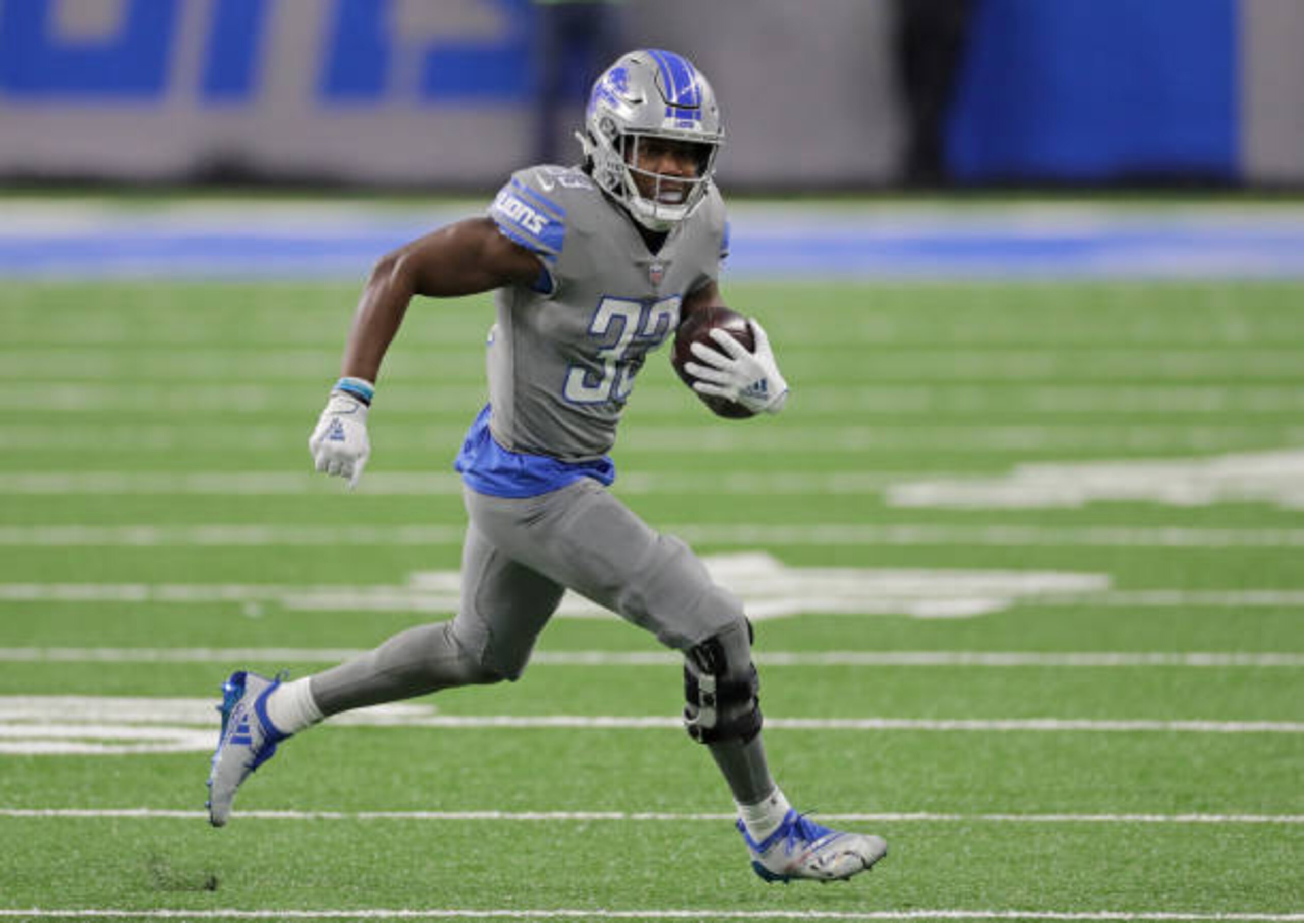 DETROIT, MICHIGAN - DECEMBER 26: Kerryon Johnson #33 of the Detroit Lions runs for a first down during the first quarter of the game against Tampa Bay at Ford Field on December 26, 2020 in Detroit, Michigan. Tampa defeated Detroit 47-7 (Photo by Leon Halip/Getty Images)