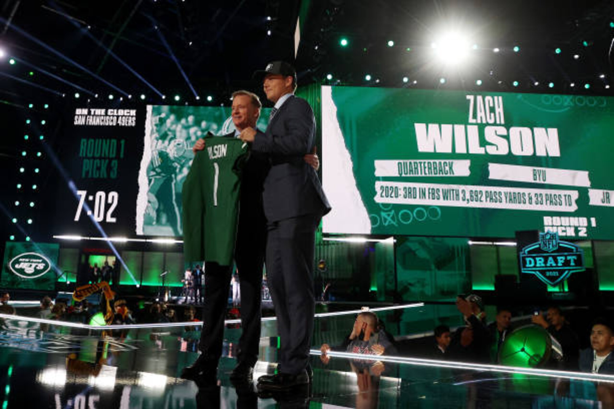 CLEVELAND, OHIO - APRIL 29: Zach Wilson stands onstage with NFL Commissioner Roger Goodell after being drafted second by the New York Jets during round one of the 2021 NFL Draft at the Great Lakes Science Center on April 29, 2021 in Cleveland, Ohio. (Photo by Gregory Shamus/Getty Images)