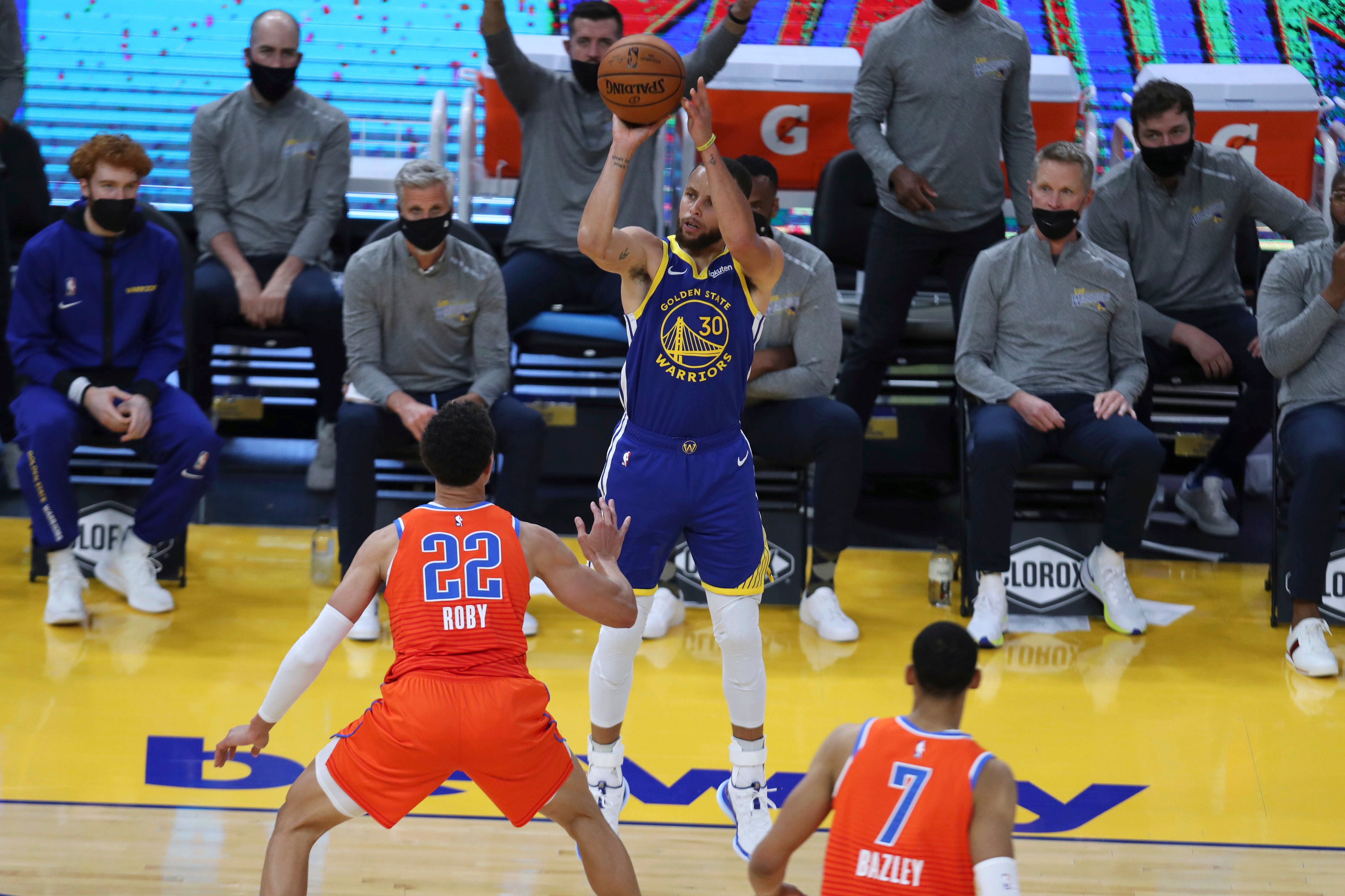 Golden State Warriors' Stephen Curry, center, shoots a 3-pointer against Oklahoma City Thunder's Isaiah Roby during the first half of an NBA basketball game in San Francisco, Saturday, May 8, 2021. (AP Photo/Jed Jacobsohn)