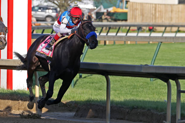 LOUISVILLE, KY - MAY 01:  Medina Spirit (8) ridden by John Velasquez leads on the inside coming through the final turn and wins the 147th Running of the Kentucky Derby on May 1, 2021 at Churchill Downs in Louisville, Kentucky. (Photo by Brian Spurlock/Icon Sportswire via Getty Images)