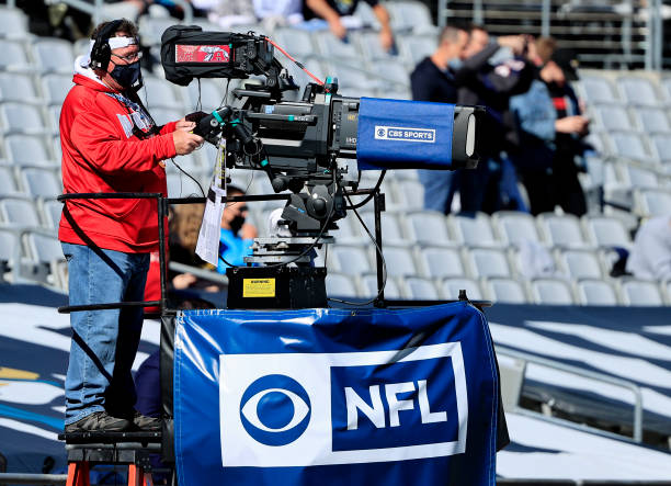 JACKSONVILLE, FLORIDA - DECEMBER 27: A CBS camera man films the game between the Chicago Bears and the Jacksonville Jaguars wearing a mask at TIAA Bank Field on December 27, 2020 in Jacksonville, Florida. (Photo by Sam Greenwood/Getty Images)