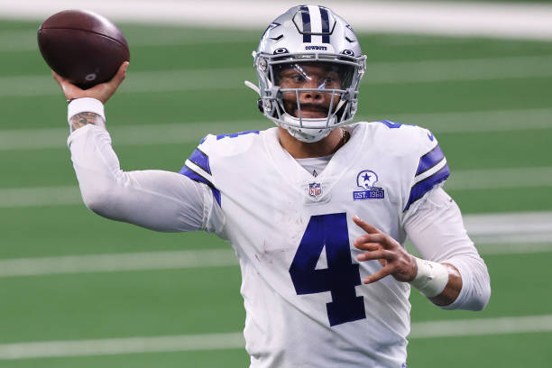 ARLINGTON, TEXAS - OCTOBER 11:  Dak Prescott #4 of the Dallas Cowboys attempts a pass against the New York Giants during the second quarter at AT&T Stadium on October 11, 2020 in Arlington, Texas. (Photo by Tom Pennington/Getty Images)