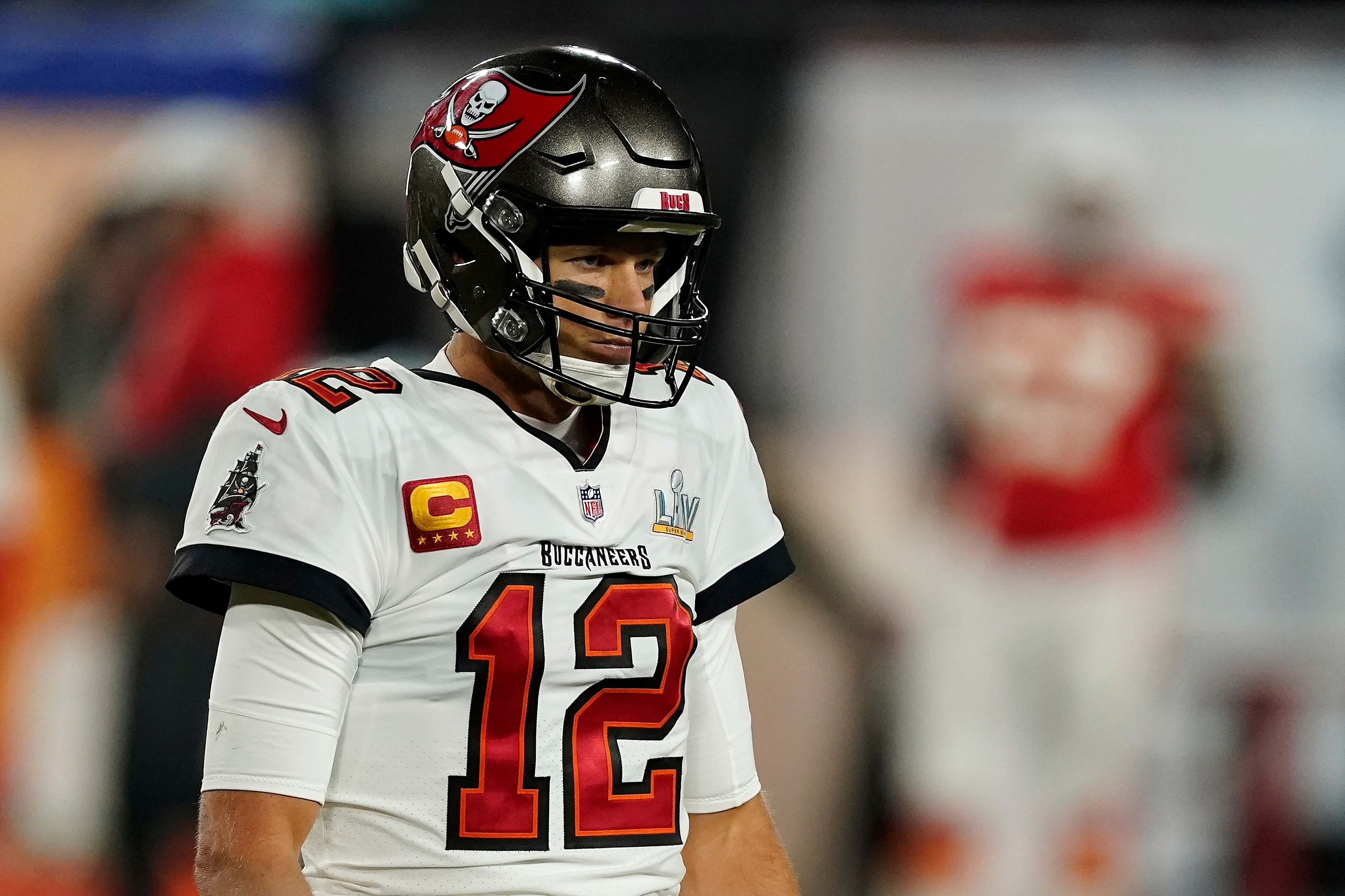Tampa Bay Buccaneers quarterback Tom Brady (12) walks toward the sideline during the second half of the NFL Super Bowl 55 football game against the Kansas City Chiefs, Sunday, Feb. 7, 2021, in Tampa, Fla. The Tampa Bay Buccaneers defeated the Kansas City Chiefs 31-9. (AP Photo/Steve Luciano)