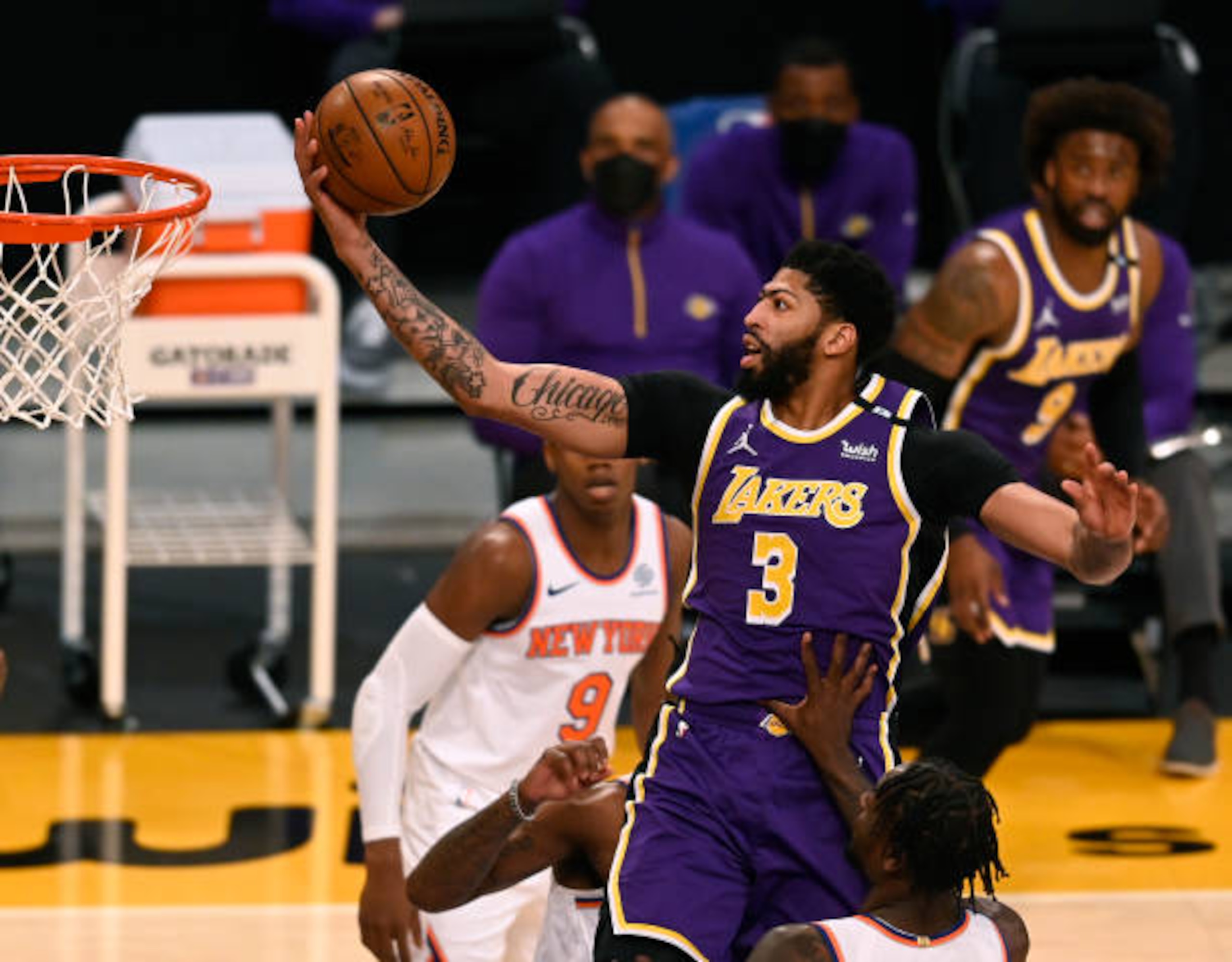 LOS ANGELES, CALIFORNIA - MAY 11: Anthony Davis #3 of the Los Angeles Lakers attempts a layup between Julius Randle #30 and Reggie Bullock #25 of the New York Knicks during the first quarter at Staples Center on May 11, 2021 in Los Angeles, California. (Photo by Harry How/Getty Images)  NOTE TO USER: User expressly acknowledges and agrees that, by downloading and or using this photograph, User is consenting to the terms and conditions of the Getty Images License Agreement.