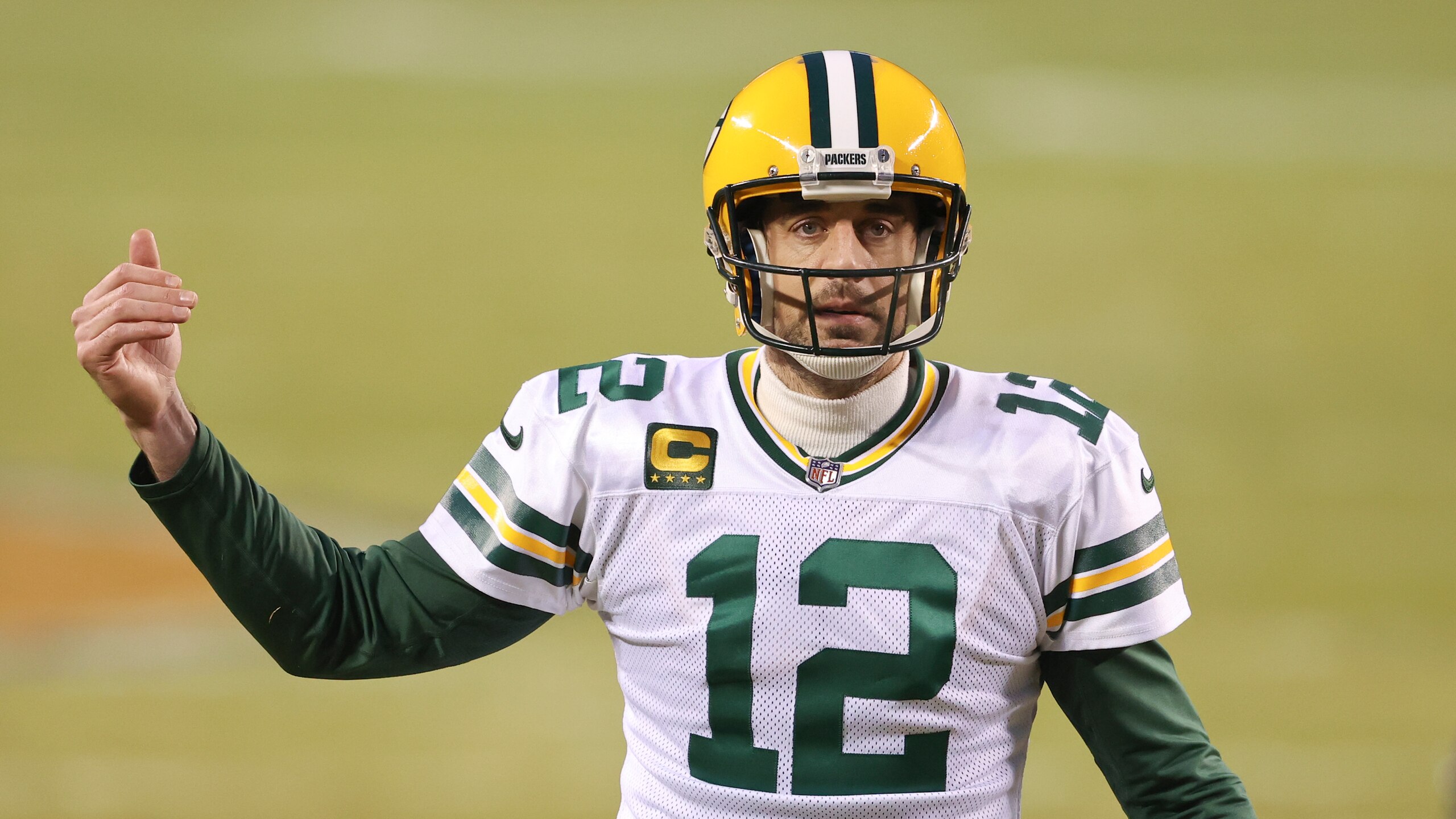 Green Bay Packers quarterback Aaron Rodgers (12) in action during the first half of an NFL football game against the Chicago Bears, Sunday, Jan. 3, 2021, in Chicago. (AP Photo/Kamil Krzaczynski)