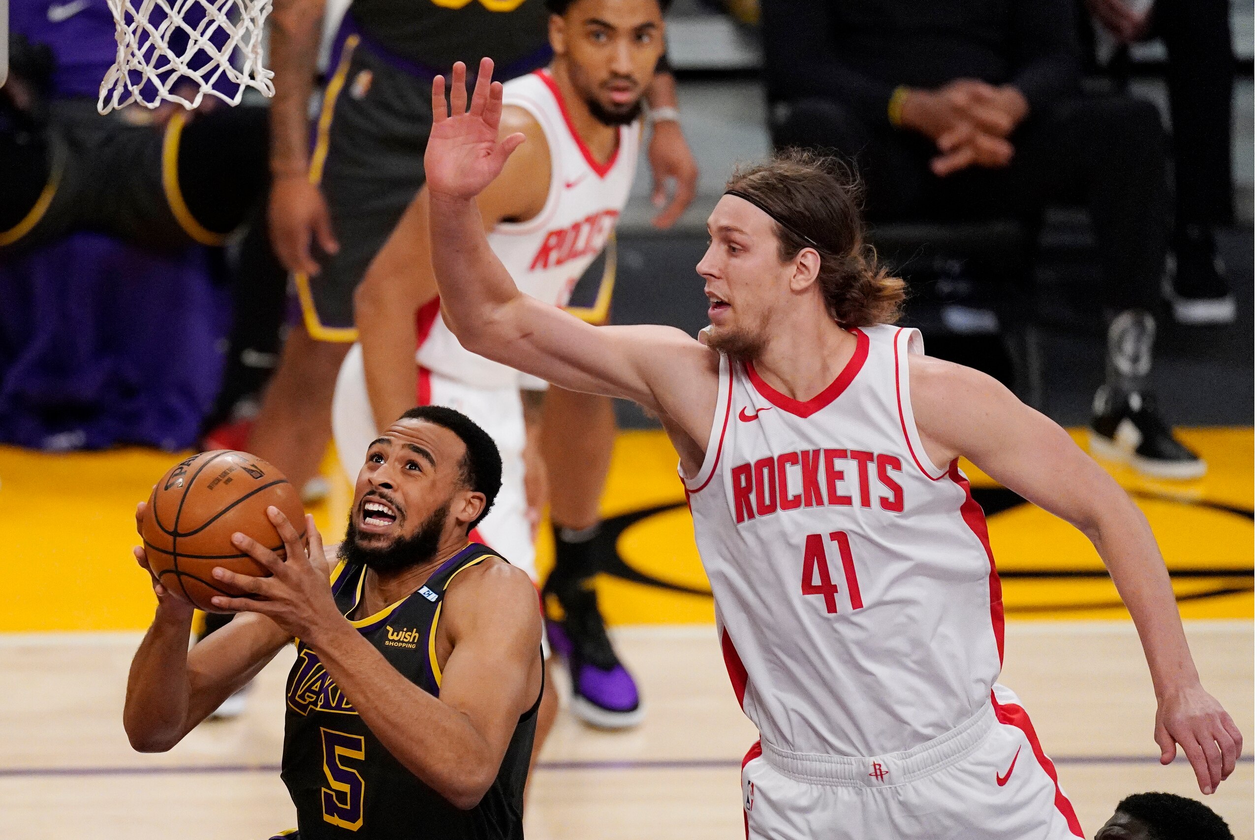 Los Angeles Lakers guard Talen Horton-Tucker, left, shoots as Houston Rockets forward Kelly Olynyk defends during the first half of an NBA basketball game Wednesday, May 12, 2021, in Los Angeles. (AP Photo/Mark J. Terrill) Los Angeles Lakers guard Talen Horton-Tucker, left, shoots as Houston Rockets forward Kelly Olynyk defends during the first half of an NBA basketball game Wednesday, May 12, 2021, in Los Angeles. (AP Photo/Mark J. Terrill)