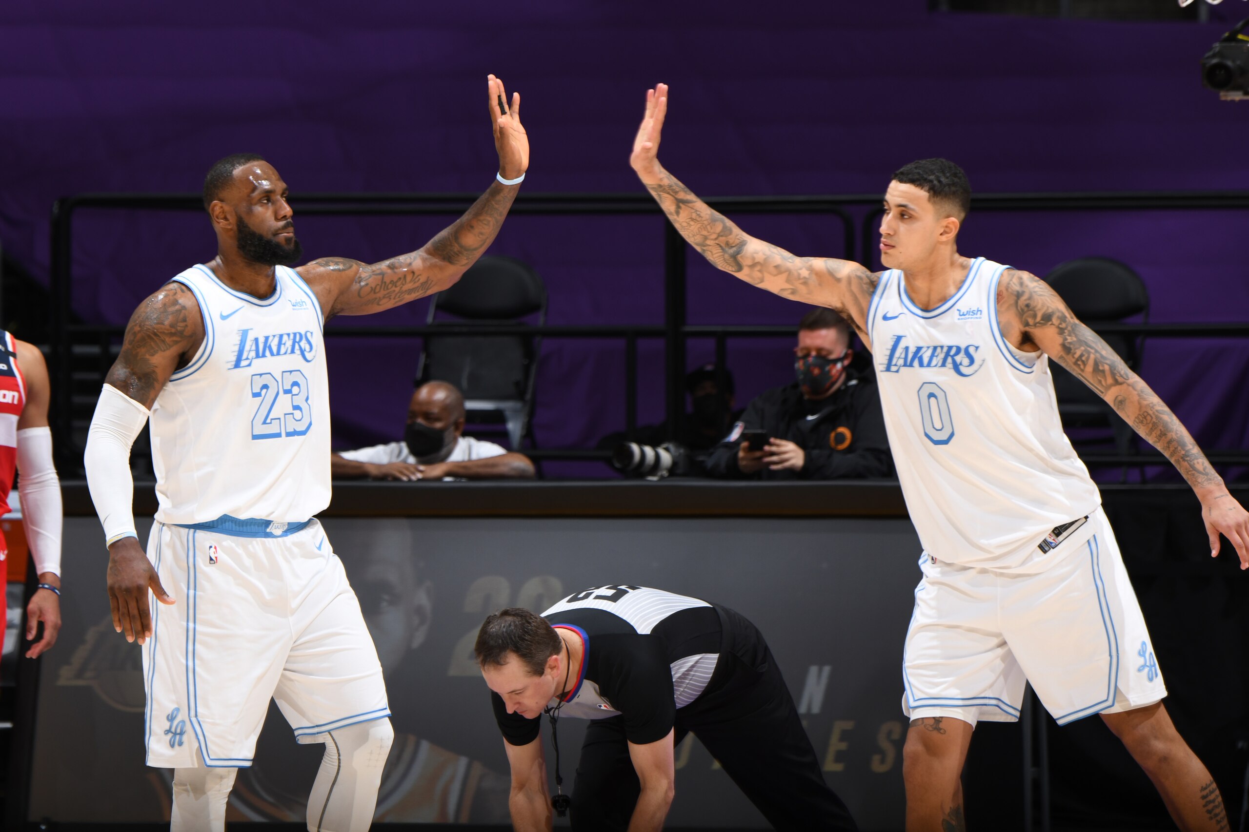 LOS ANGELES, CA - FEBRUARY 22: LeBron James #23 of the Los Angeles Lakers high fives Kyle Kuzma #0 of the Los Angeles Lakers during the game against the Washington Wizards on February 22, 2021 at STAPLES Center in Los Angeles, California. NOTE TO USER: User expressly acknowledges and agrees that, by downloading and/or using this Photograph, user is consenting to the terms and conditions of the Getty Images License Agreement. Mandatory Copyright Notice: Copyright 2021 NBAE (Photo by Adam Pantozzi/NBAE via Getty Images) LOS ANGELES, CA - FEBRUARY 22: LeBron James #23 of the Los Angeles Lakers high fives Kyle Kuzma #0 of the Los Angeles Lakers during the game against the Washington Wizards on February 22, 2021 at STAPLES Center in Los Angeles, California. NOTE TO USER: User expressly acknowledges and agrees that, by downloading and/or using this Photograph, user is consenting to the terms and conditions of the Getty Images License Agreement. Mandatory Copyright Notice: Copyright 2021 NBAE (Photo by Adam Pantozzi/NBAE via Getty Images)