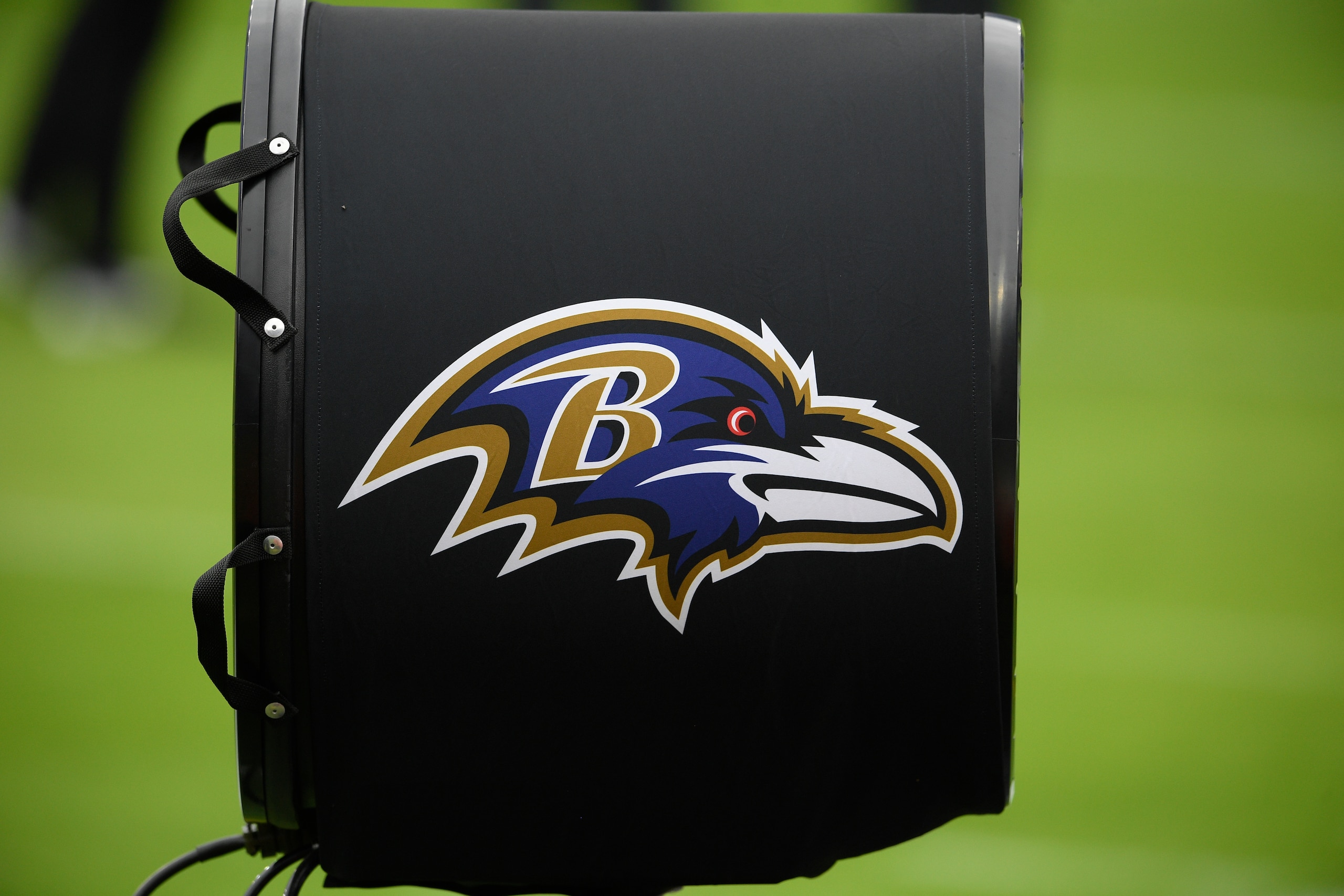 A fan bearing the Baltimore Ravens logo is seen prior to an NFL football game against the Cincinnati Bengals, Sunday, Oct. 11, 2020, in Baltimore. (AP Photo/Nick Wass)