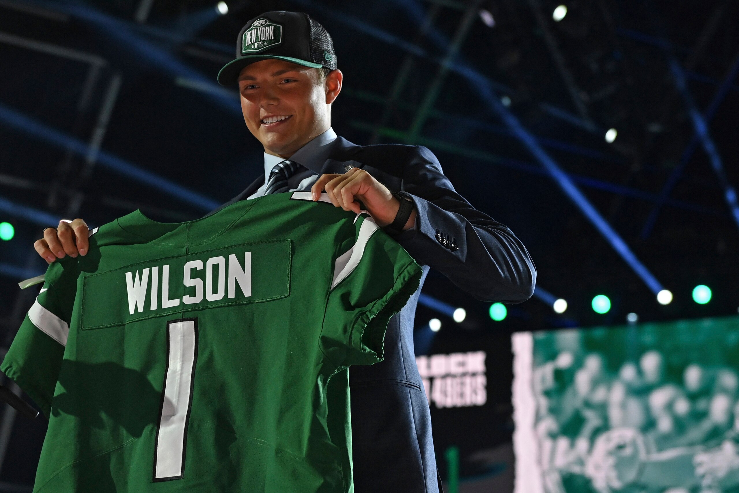 BYU quarterback Zach Wilson holds a team jersey after the New York Jets selected Wilson with the second pick in the first round of the NFL football draft Thursday April 29, 2021, in Cleveland. (AP Photo/David Dermer)