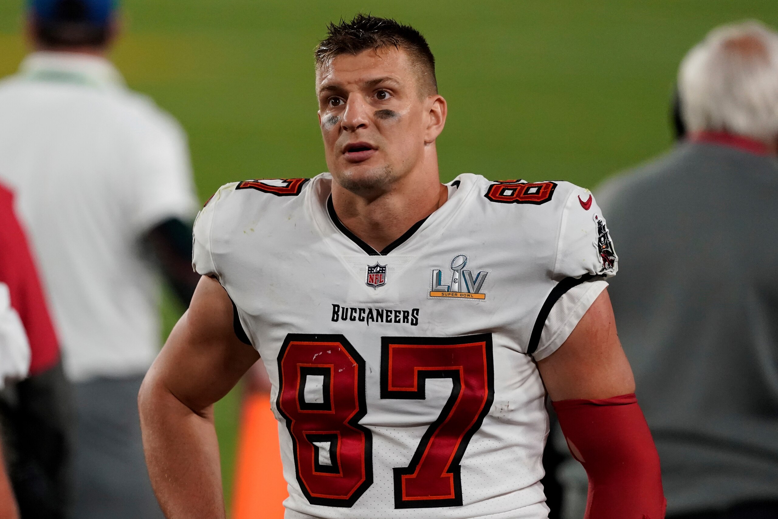 Tampa Bay Buccaneers tight end Rob Gronkowski (87) looks out towards the crowd from the sideline during the second half of the NFL Super Bowl 55 football game against the Kansas City Chiefs, Sunday, Feb. 7, 2021, in Tampa, Fla. The Tampa Bay Buccaneers defeated the Kansas City Chiefs 31-9. (AP Photo/Steve Luciano)