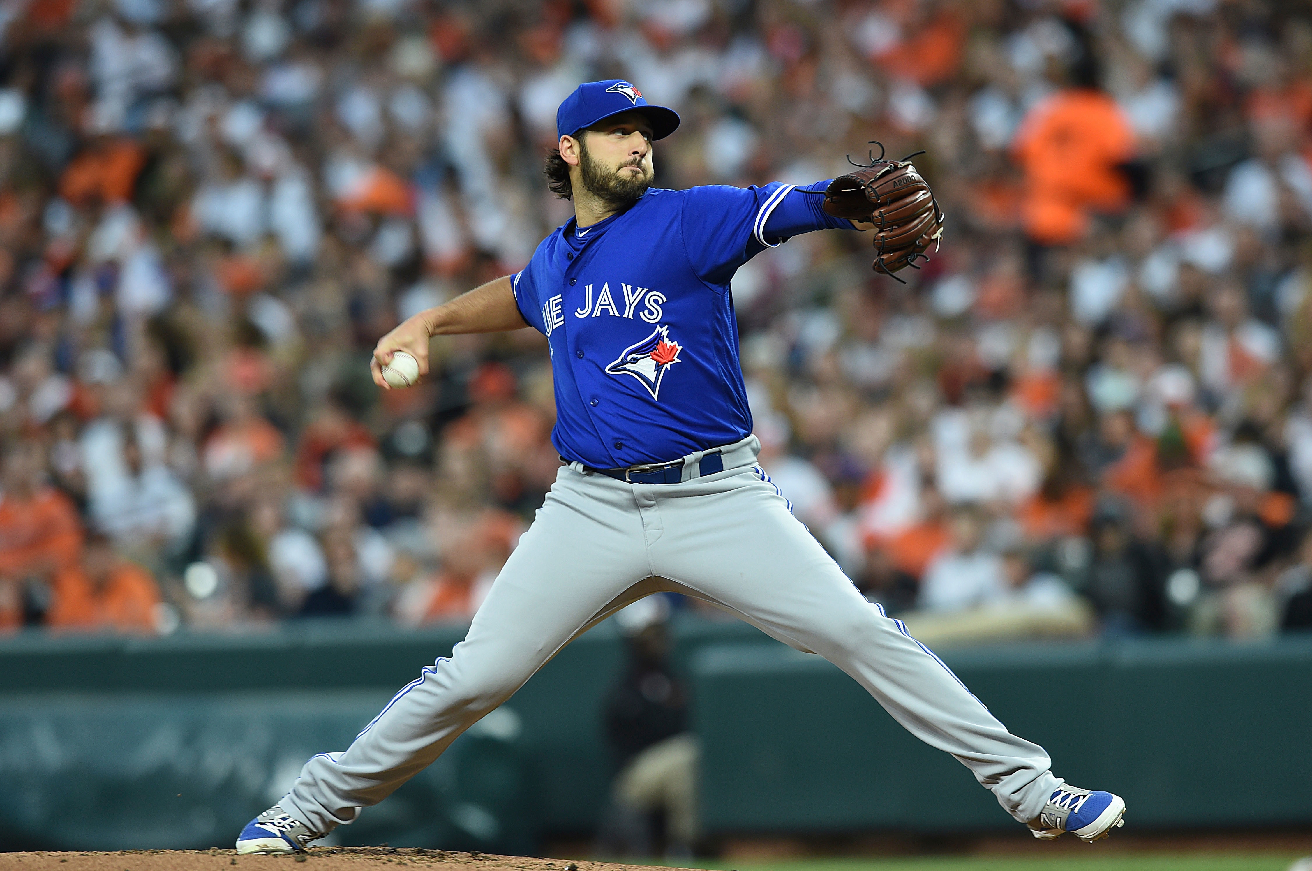 Toronto Blue Jays starting pitcher Mike Bolsinger delivers against the Baltimore Orioles during the first inning of a baseball game, Saturday, May 20, 2017, in Baltimore. (AP Photo/Gail Burton)