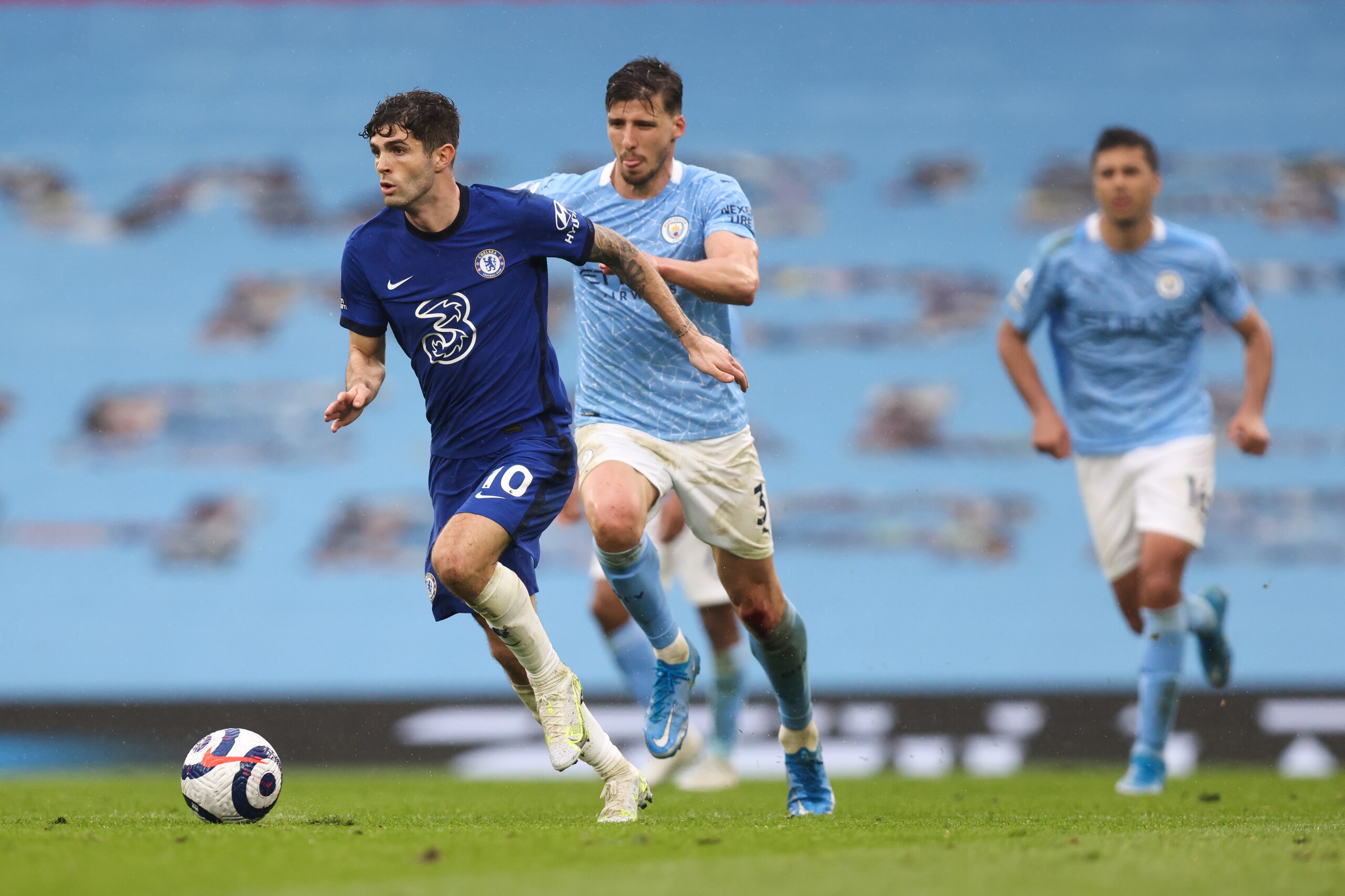MANCHESTER, ENGLAND - MAY 08: Christian Pulisic of Chelsea and Ruben Dias of Manchester City during the Premier League match between Manchester City and Chelsea at Etihad Stadium on May 8, 2021 in Manchester, United Kingdom. Sporting stadiums around the UK remain under strict restrictions due to the Coronavirus Pandemic as Government social distancing laws prohibit fans inside venues resulting in games being played behind closed doors. (Photo by Matthew Ashton - AMA/Getty Images) MANCHESTER, ENGLAND - MAY 08: Christian Pulisic of Chelsea and Ruben Dias of Manchester City during the Premier League match between Manchester City and Chelsea at Etihad Stadium on May 8, 2021 in Manchester, United Kingdom. Sporting stadiums around the UK remain under strict restrictions due to the Coronavirus Pandemic as Government social distancing laws prohibit fans inside venues resulting in games being played behind closed doors. (Photo by Matthew Ashton - AMA/Getty Images)