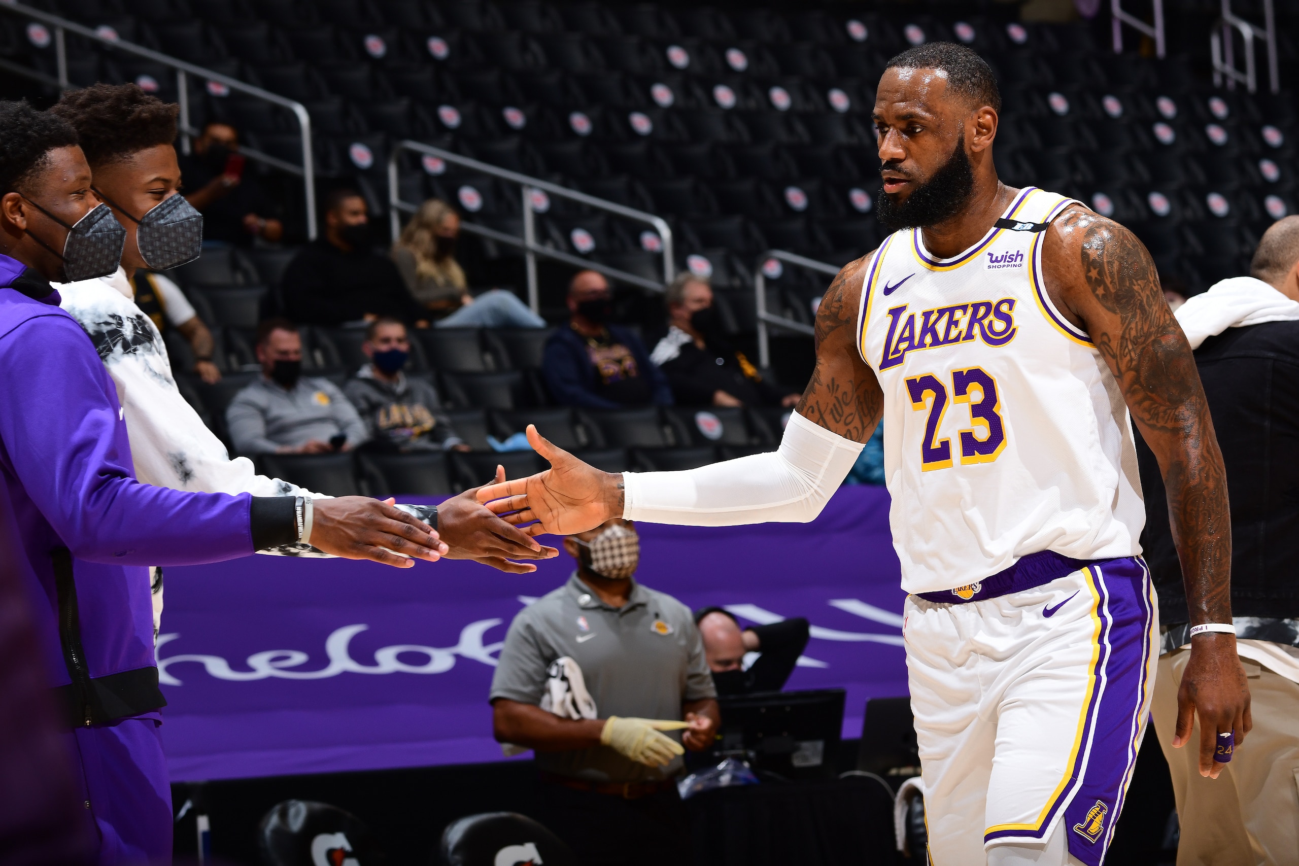 LOS ANGELES, CA - MAY 2: LeBron James #23 of the Los Angeles Lakers high fives Kostas Antetokounmpo #37 of the Los Angeles Lakers during the game against the Toronto Raptors on May 2, 2021 at STAPLES Center in Los Angeles, California. NOTE TO USER: User expressly acknowledges and agrees that, by downloading and/or using this Photograph, user is consenting to the terms and conditions of the Getty Images License Agreement. Mandatory Copyright Notice: Copyright 2021 NBAE (Photo by Adam Pantozzi/NBAE via Getty Images)