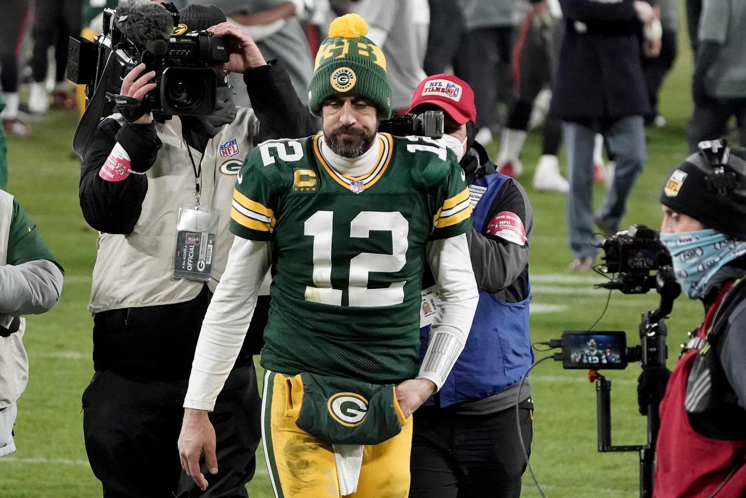 Green Bay Packers quarterback Aaron Rodgers (12) walks off the field after the NFC championship NFL football game against the Tampa Bay Buccaneers in Green Bay, Wis., Sunday, Jan. 24, 2021. The Buccaneers defeated the Packers 31-26 to advance to the Super Bowl. (AP Photo/Morry Gash) Green Bay Packers quarterback Aaron Rodgers (12) walks off the field after the NFC championship NFL football game against the Tampa Bay Buccaneers in Green Bay, Wis., Sunday, Jan. 24, 2021. The Buccaneers defeated the Packers 31-26 to advance to the Super Bowl. (AP Photo/Morry Gash)