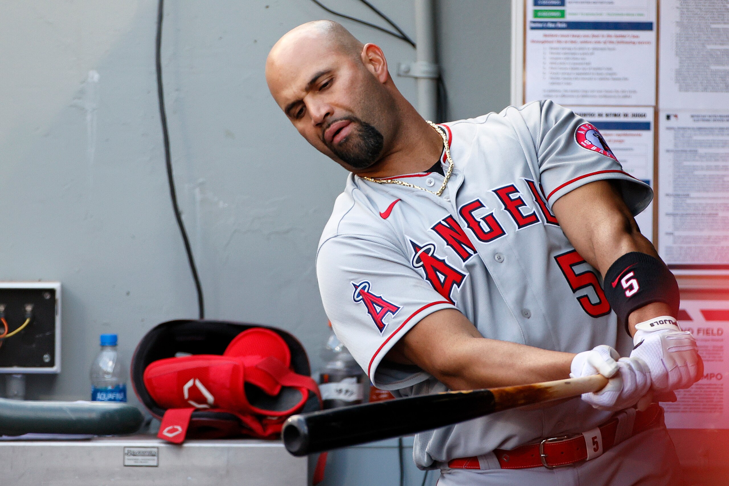 SEATTLE, WASHINGTON - MAY 02: Albert Pujols #5 of the Los Angeles Angels swings his bat in the dugout during the game against the Seattle Mariners at T-Mobile Park on May 02, 2021 in Seattle, Washington. (Photo by Steph Chambers/Getty Images)