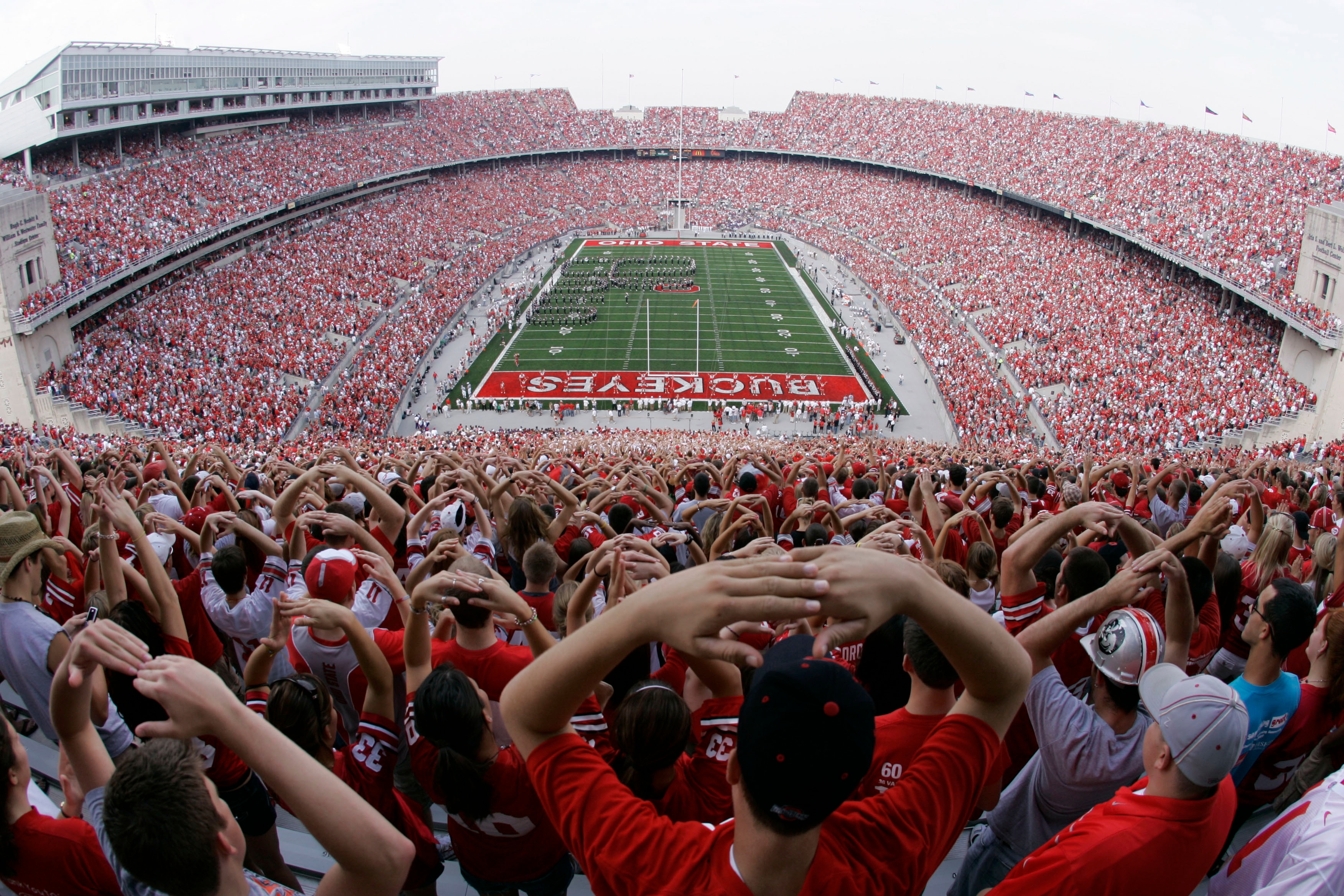 FILE - In this Sept. 22, 2007, file photo, Ohio State football fans get ready for Ohio Stadium's 500th football game, against Northwestern,  in Columbus, Ohio. The Associated Press has been ranking the best teams in college football for the last 80 seasons. (AP Photo/Kiichiro Sato, File)