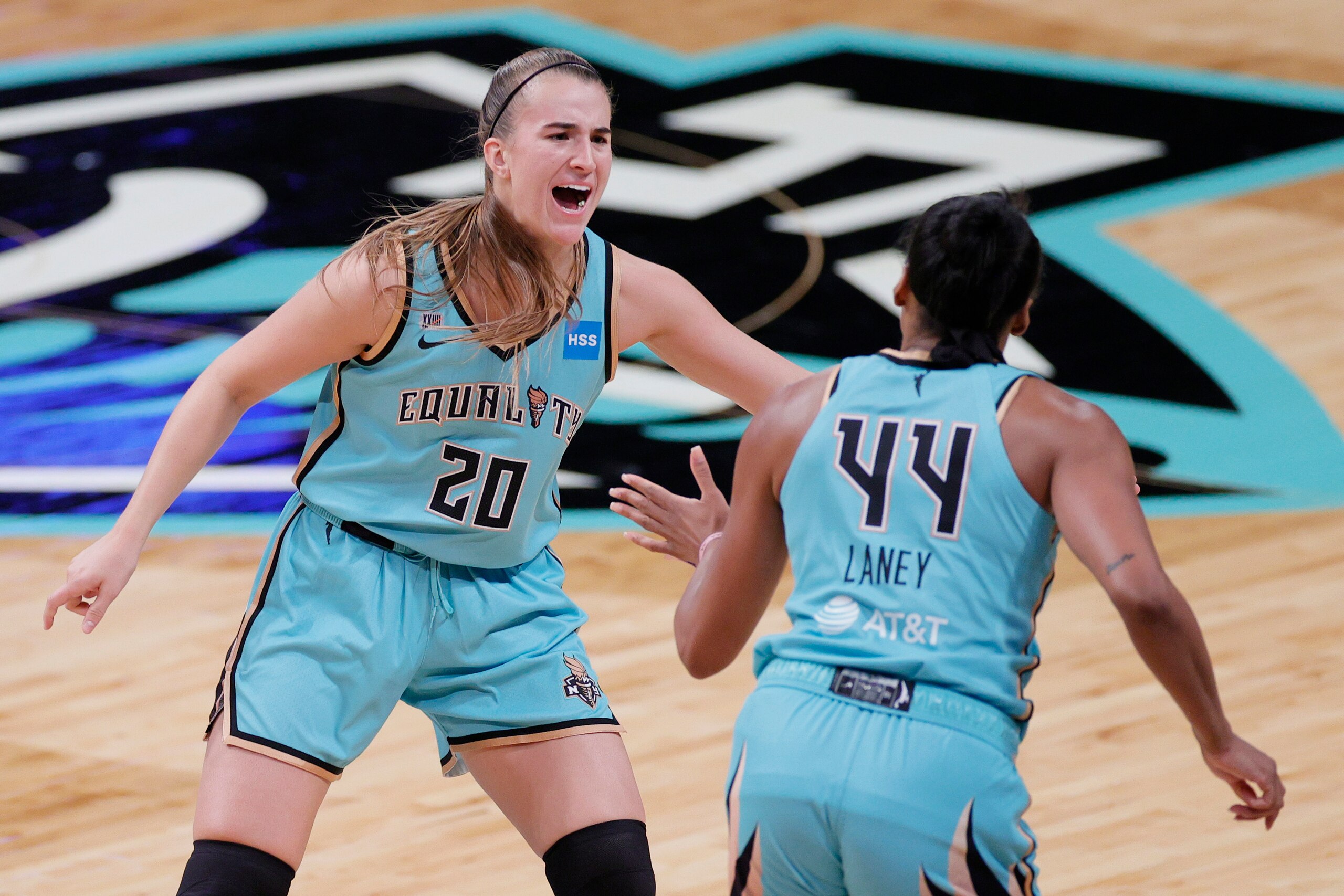 NEW YORK, NEW YORK - MAY 14: Sabrina Ionescu #20 reacts with Betnijah Laney #44 of the New York Liberty during the first half against the Indiana Fever at Barclays Center on May 14, 2021 in the Brooklyn borough of New York City. NOTE TO USER: User expressly acknowledges and agrees that, by downloading and or using this photograph, User is consenting to the terms and conditions of the Getty Images License Agreement.  (Photo by Sarah Stier/Getty Images)