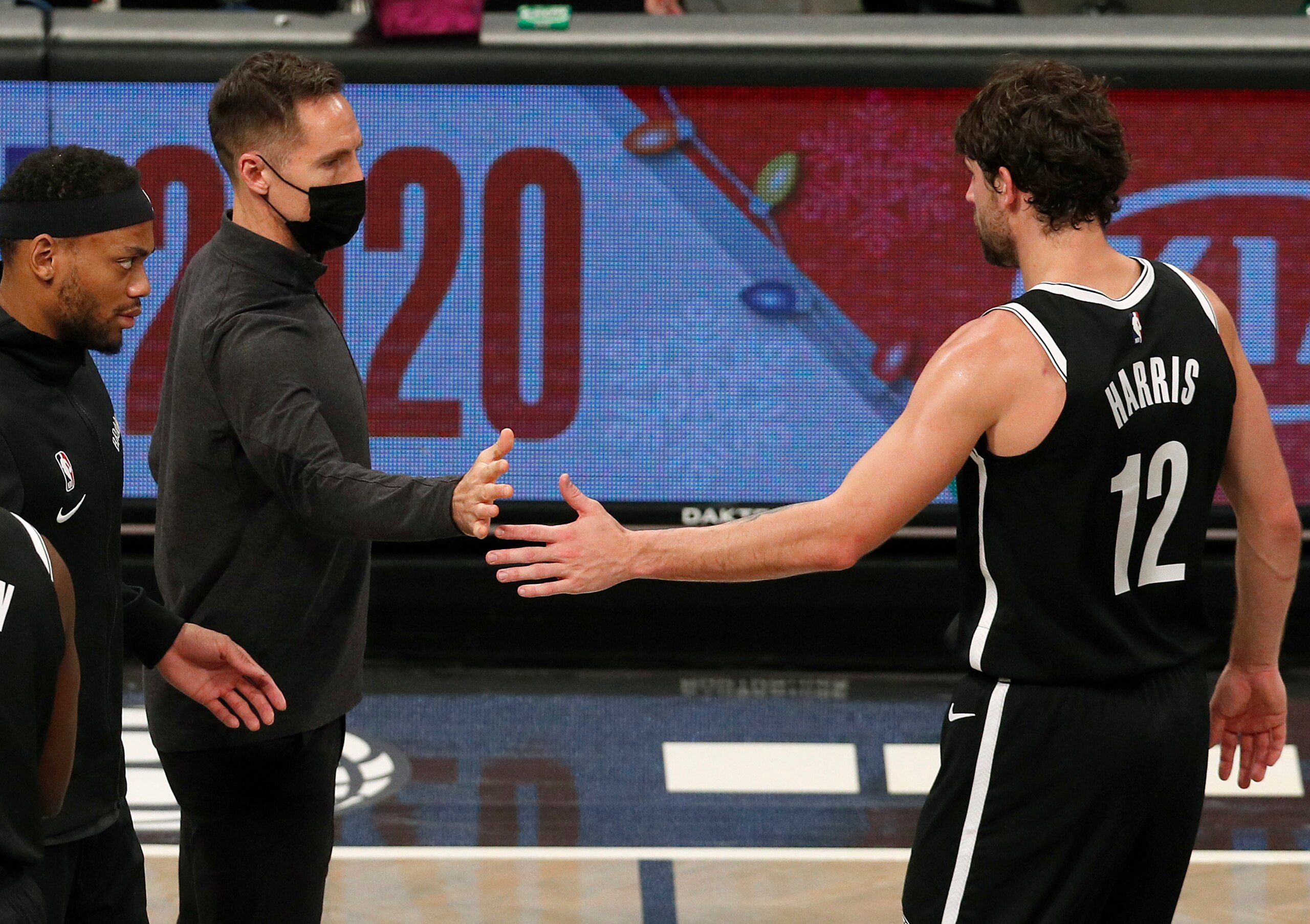 NEW YORK, NEW YORK - DECEMBER 22: (NEW YORK DAILIES OUT)  Head coach Steve Nash and Joe Harris #12 of the Brooklyn Nets in action against the Golden State Warriors at Barclays Center on December 22, 2020 in New York City. The Nets defeated the Warriors 125-99. NOTE TO USER: User expressly acknowledges and agrees that, by downloading and/or using this photograph, user is consenting to the terms and conditions of the Getty Images License Agreement. (Photo by Jim McIsaac/Getty Images)