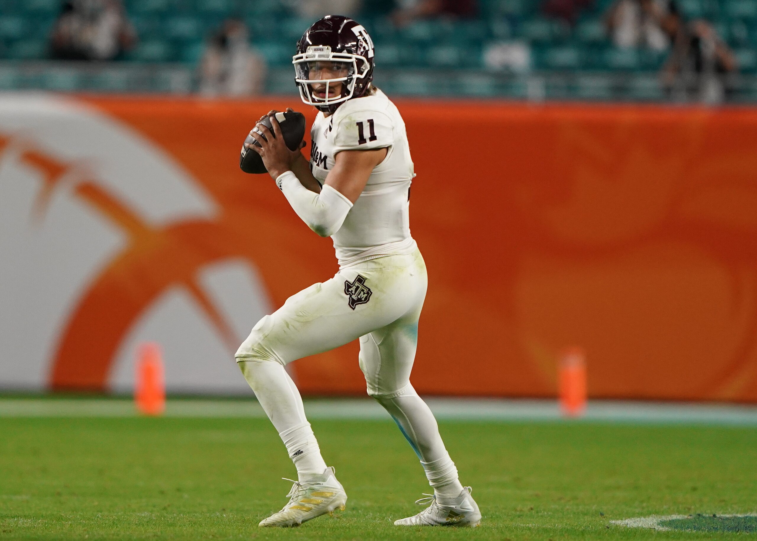 MIAMI GARDENS, FLORIDA - JANUARY 02: Kellen Mond #11 of the Texas A&M Aggies looks to pass against the North Carolina Tar Heels during the first half of the Capital One Orange Bowl at Hard Rock Stadium on January 02, 2021 in Miami Gardens, Florida. (Photo by Mark Brown/Getty Images)