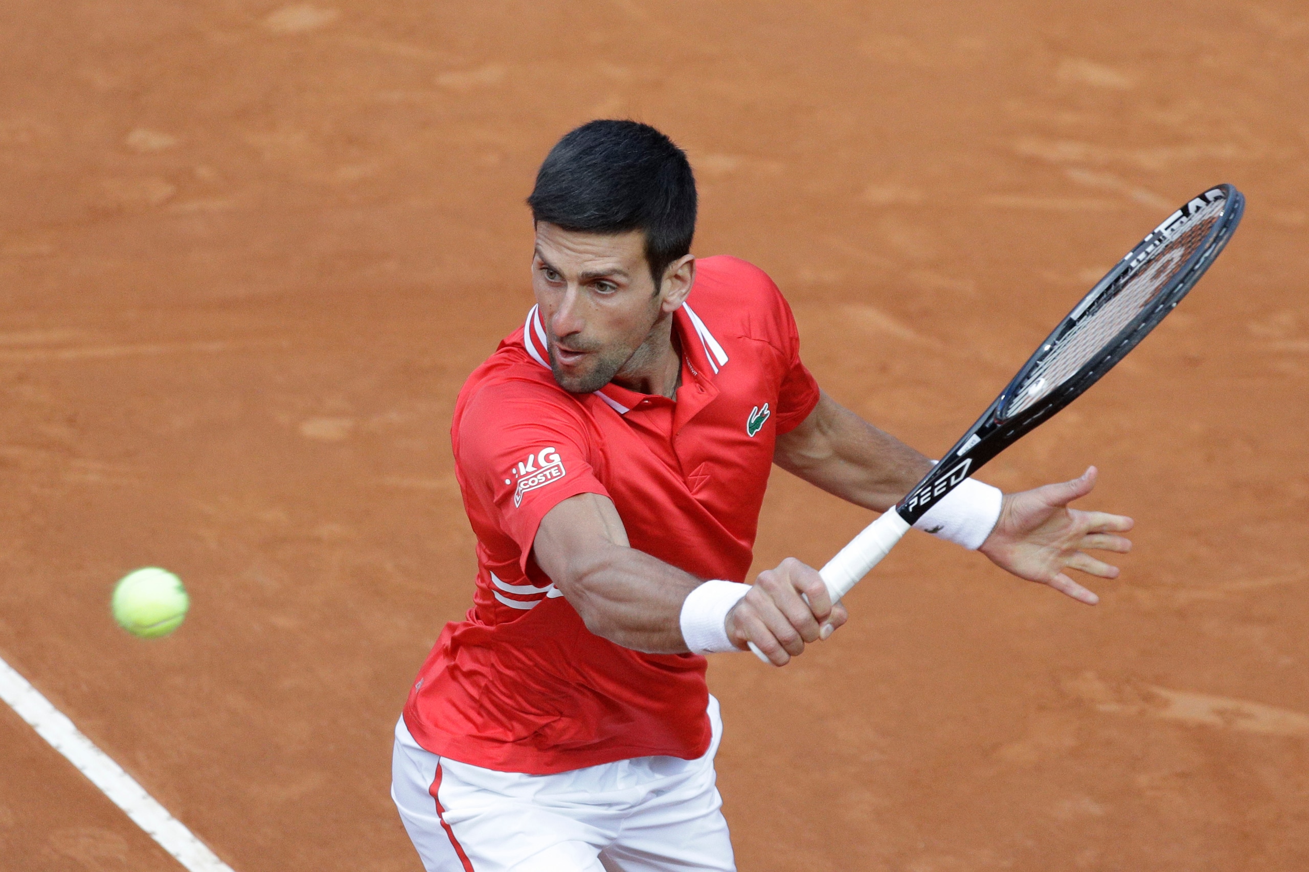 Serbia"s Novak Djokovic returns the ball to Italy's Lorenzo Sonego during their semi-final match at the Italian Open tennis tournament, in Rome, Saturday, May 15, 2021. (AP Photo/Gregorio Borgia)