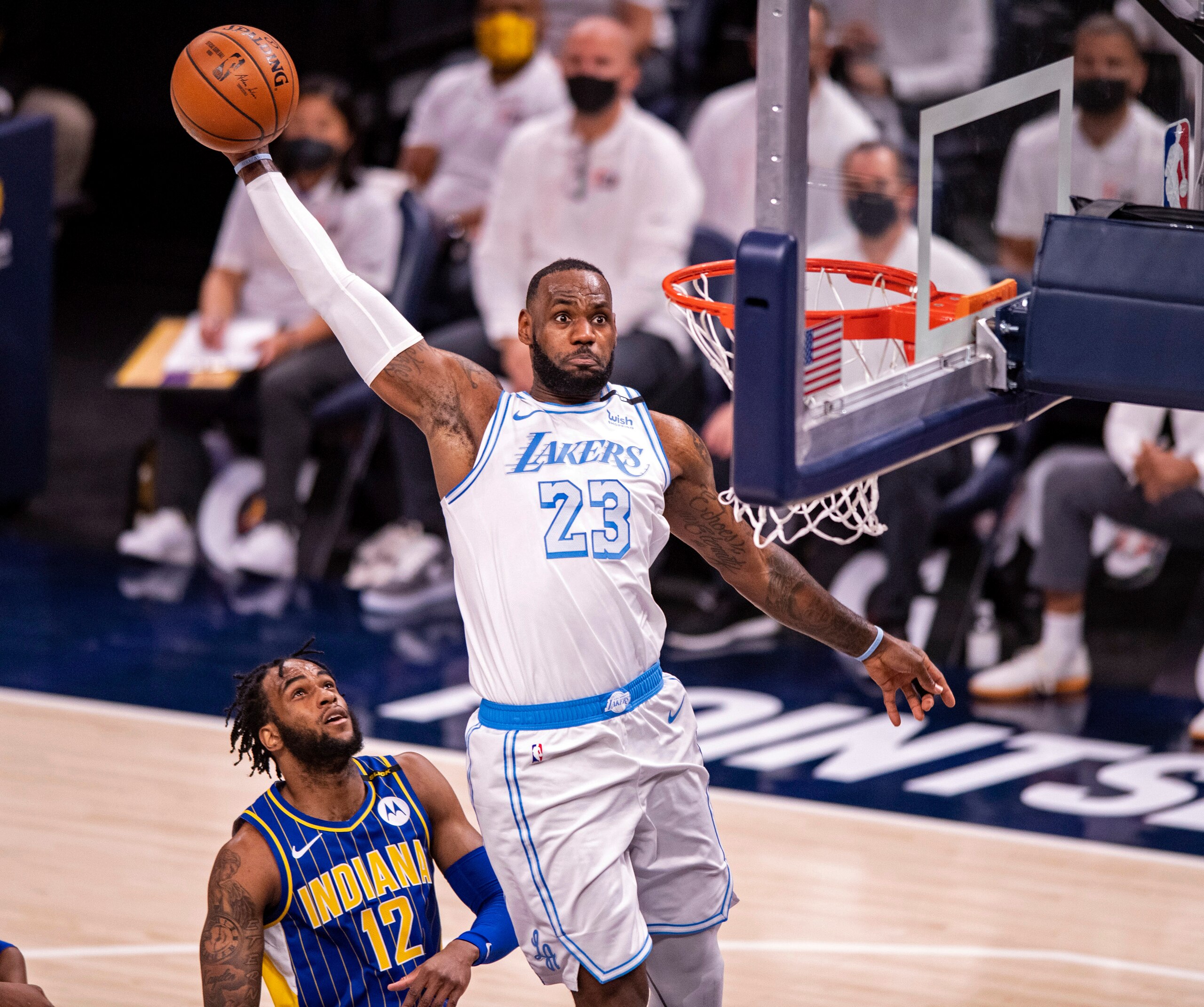 Los Angeles Lakers forward LeBron James (23) goes up high to dunk the ball during the first half of an NBA basketball game against the Indiana Pacers in Indianapolis, Saturday, May 15, 2021. (AP Photo/Doug McSchooler) Los Angeles Lakers forward LeBron James (23) goes up high to dunk the ball during the first half of an NBA basketball game against the Indiana Pacers in Indianapolis, Saturday, May 15, 2021. (AP Photo/Doug McSchooler)
