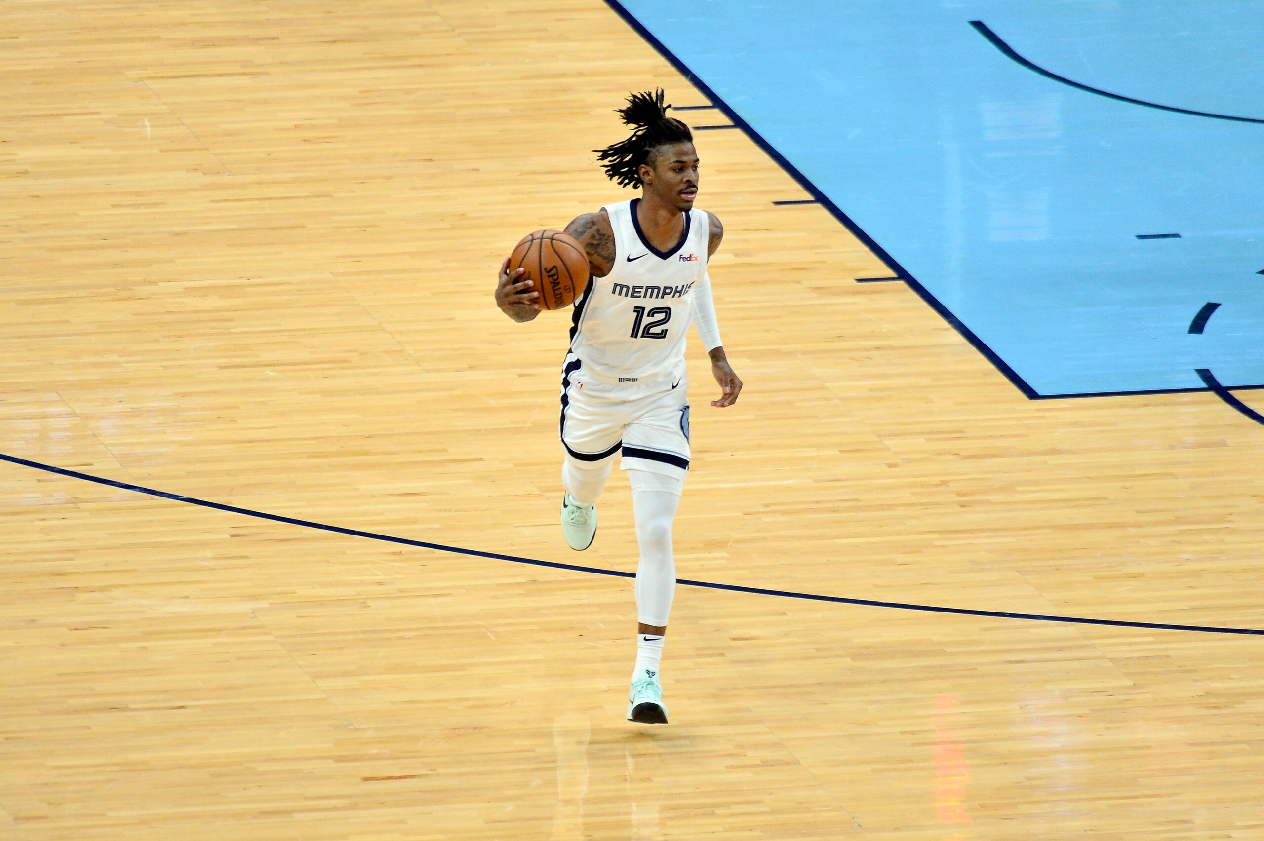 Memphis Grizzlies guard Ja Morant (12) brings the ball up court in the first half of an NBA basketball game against the Sacramento Kings Thursday, May 13, 2021, in Memphis, Tenn. (AP Photo/Brandon Dill)