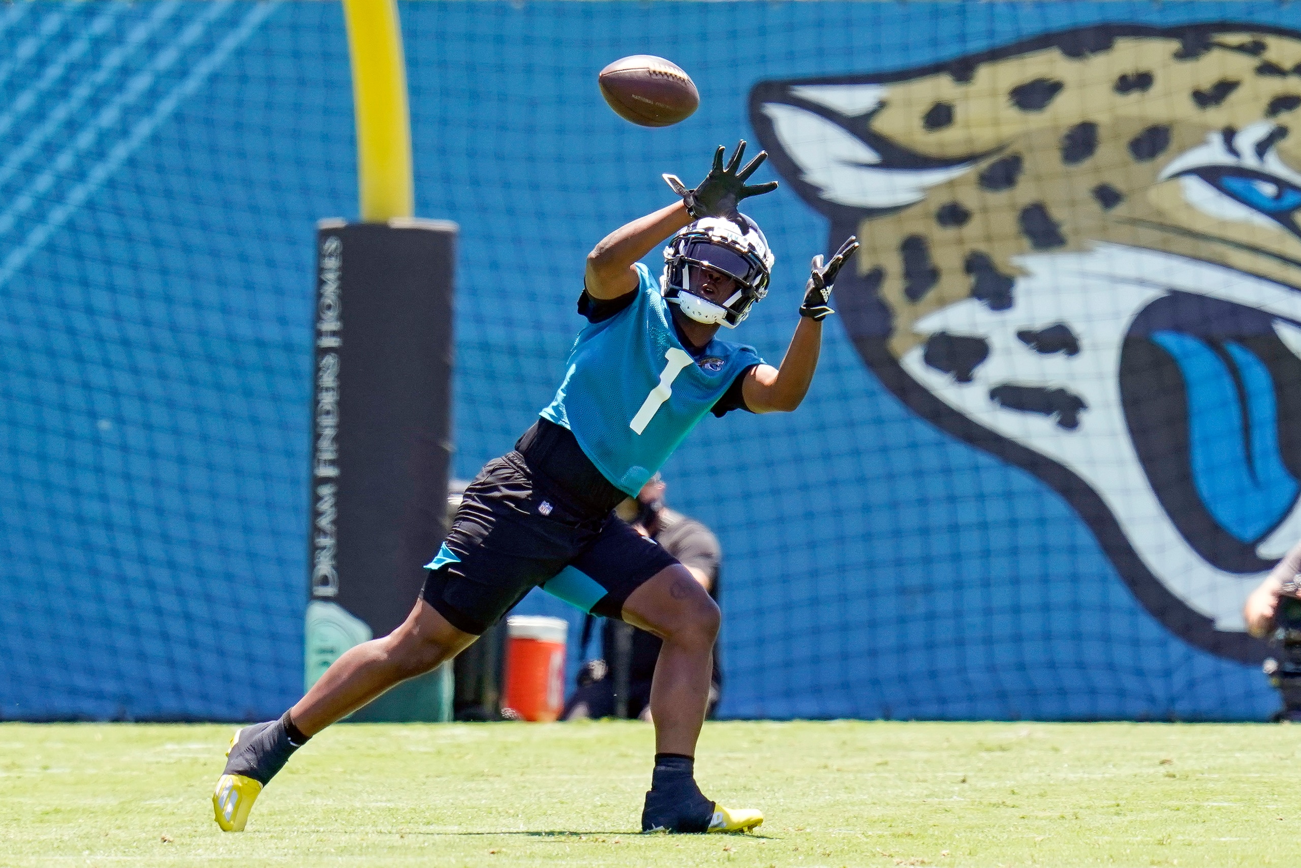 Jacksonville Jaguars running back Travis Etienne Jr. (1) catches a pass during a drill at NFL football rookie minicamp, Saturday, May 15, 2021, in Jacksonville, Fla. (AP Photo/John Raoux)