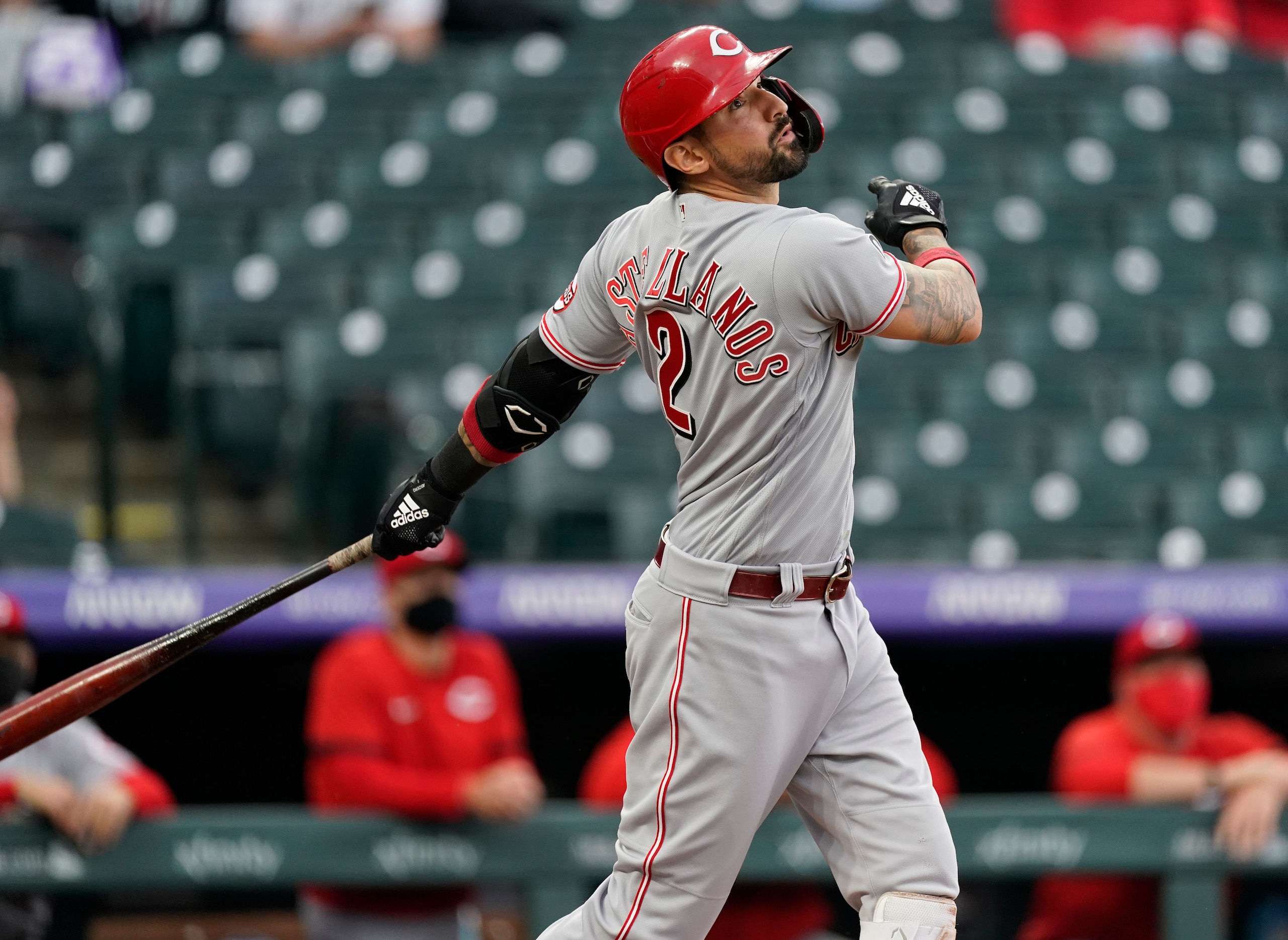 Cincinnati Reds' Nick Castellanos fouls off a pitch from Colorado Rockies starting pitcher Chi Chi Gonzalez in the first inning of a baseball game Thursday, May 13, 2021, in Denver. (AP Photo/David Zalubowski)