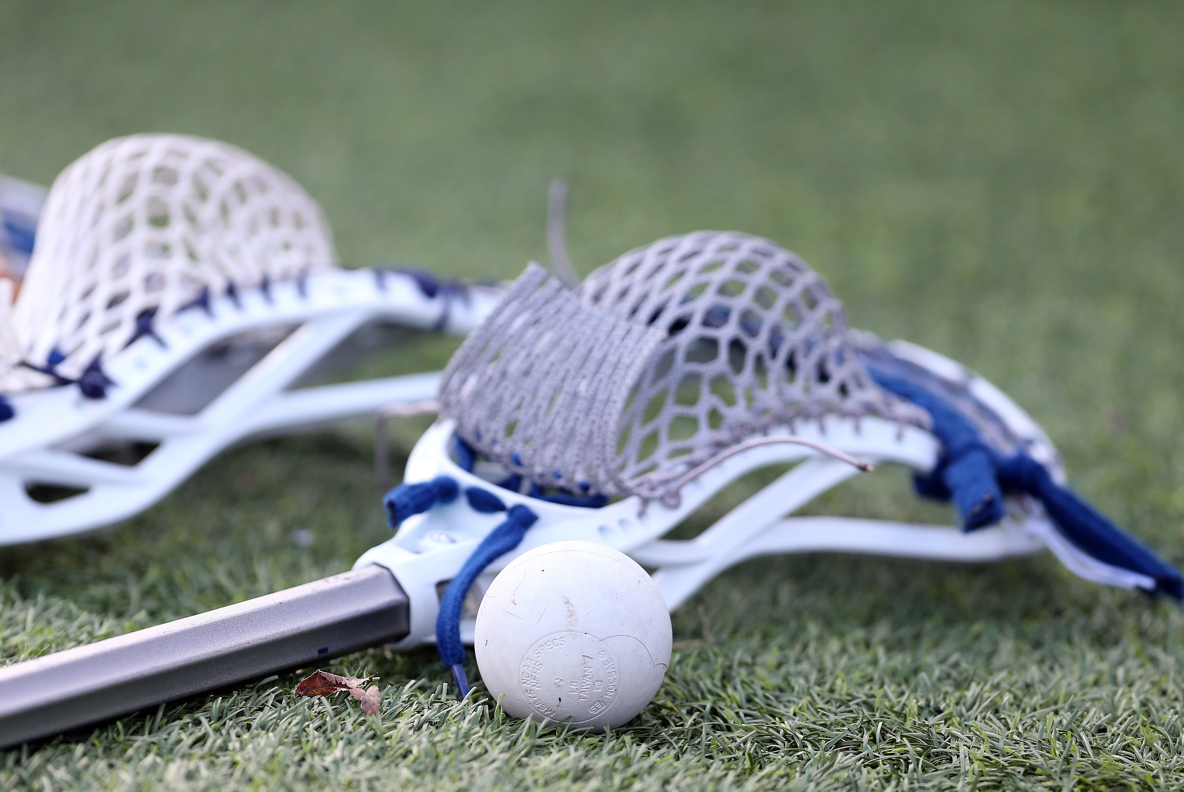 BOSTON, MA - APRIL 27: General view of a lacrosse ball and stick during the college lacrosse match between Yale Bulldogs and Harvard Crimson on April 27, 2019, at Harvard Stadium in Boston, MA. (Photo by M. Anthony Nesmith/Icon Sportswire via Getty Images)
