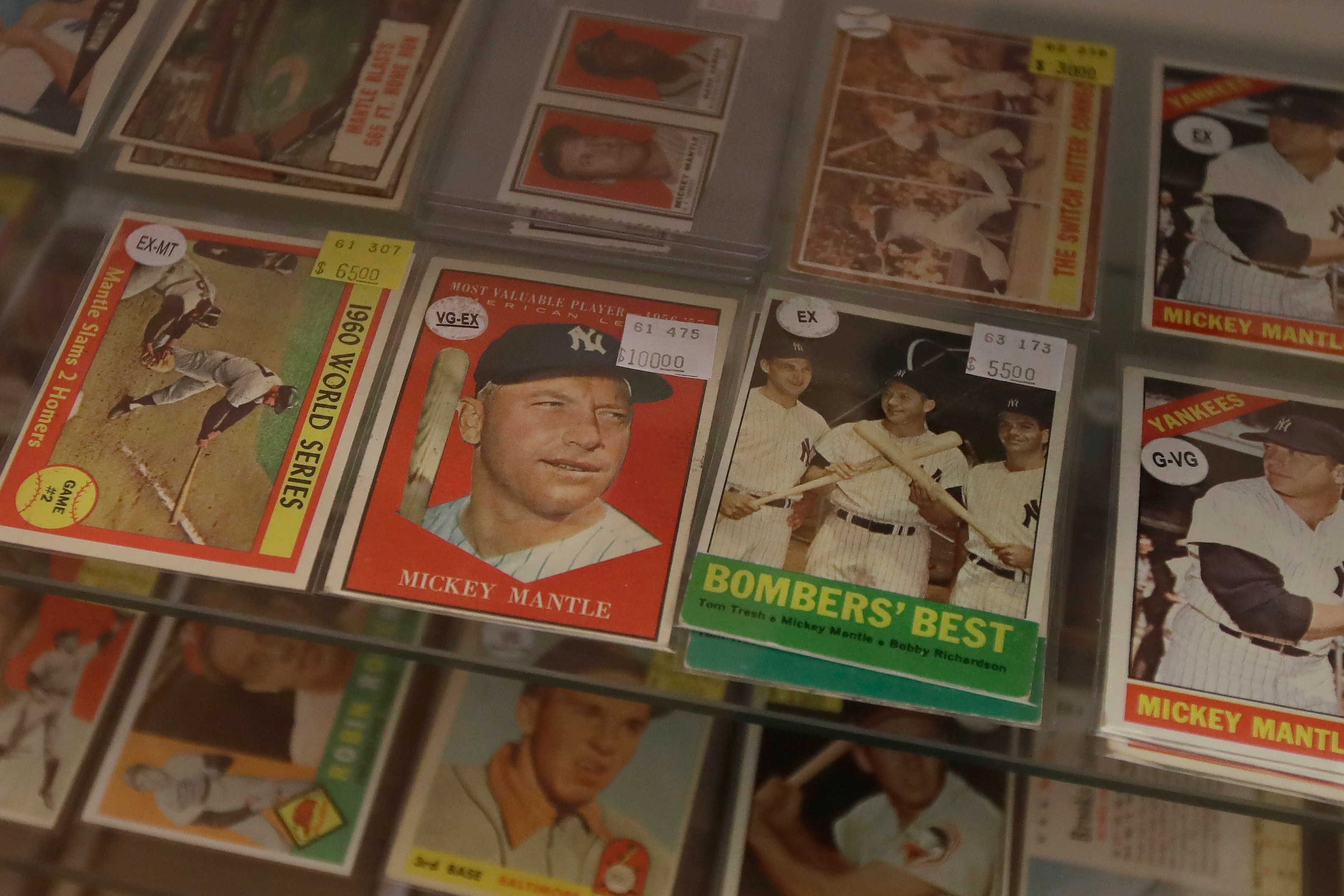 Baseball cards of former New York Yankees player Mickey Mantle are displayed with other players at Lefty's Sports Cards, which closed for COVID-19 concerns, in Burlingame, Calif., Saturday, April 25, 2020. (AP Photo/Jeff Chiu)