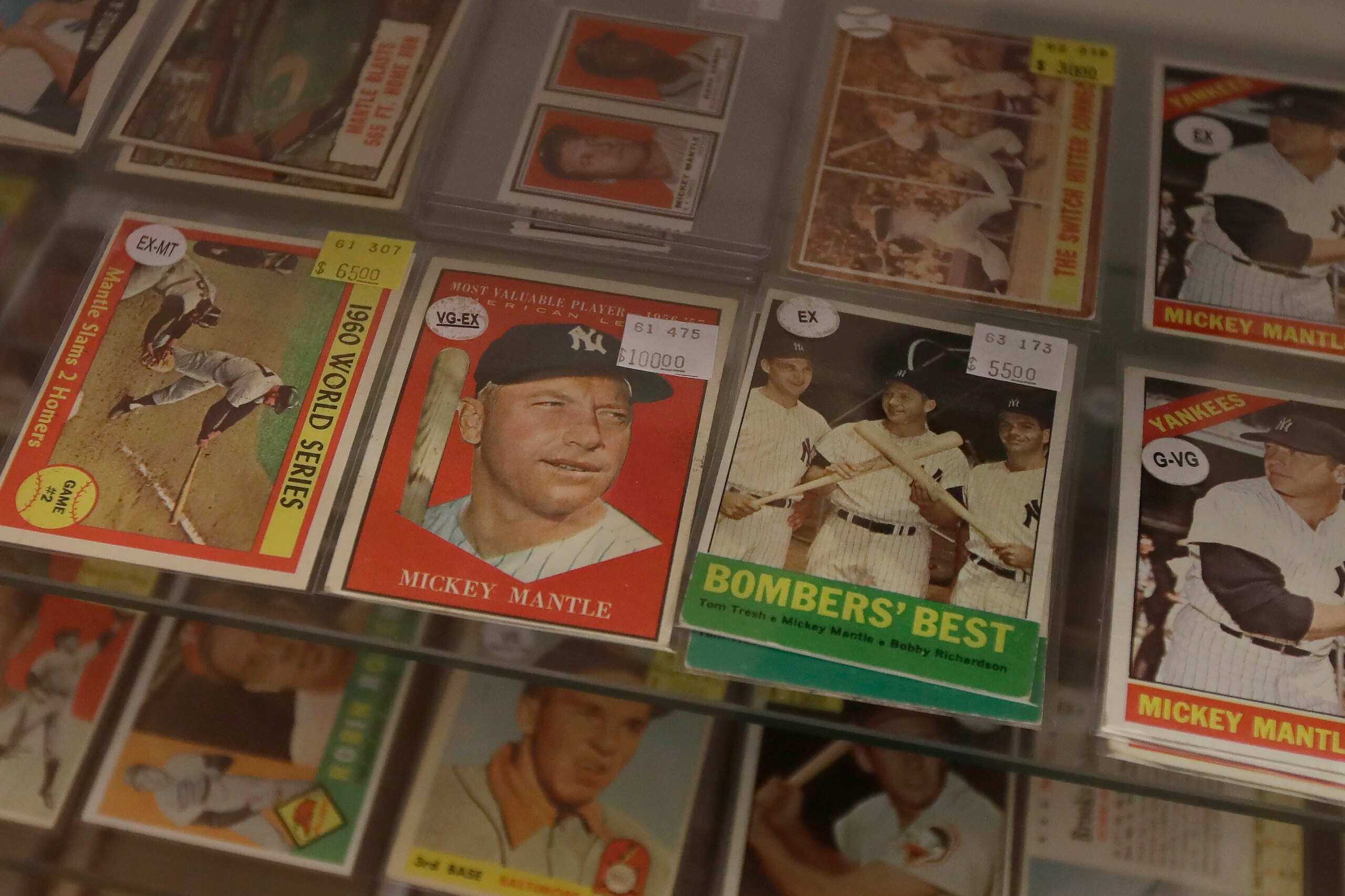 Baseball cards of former New York Yankees player Mickey Mantle are displayed with other players at Lefty's Sports Cards, which closed for COVID-19 concerns, in Burlingame, Calif., Saturday, April 25, 2020. (AP Photo/Jeff Chiu)