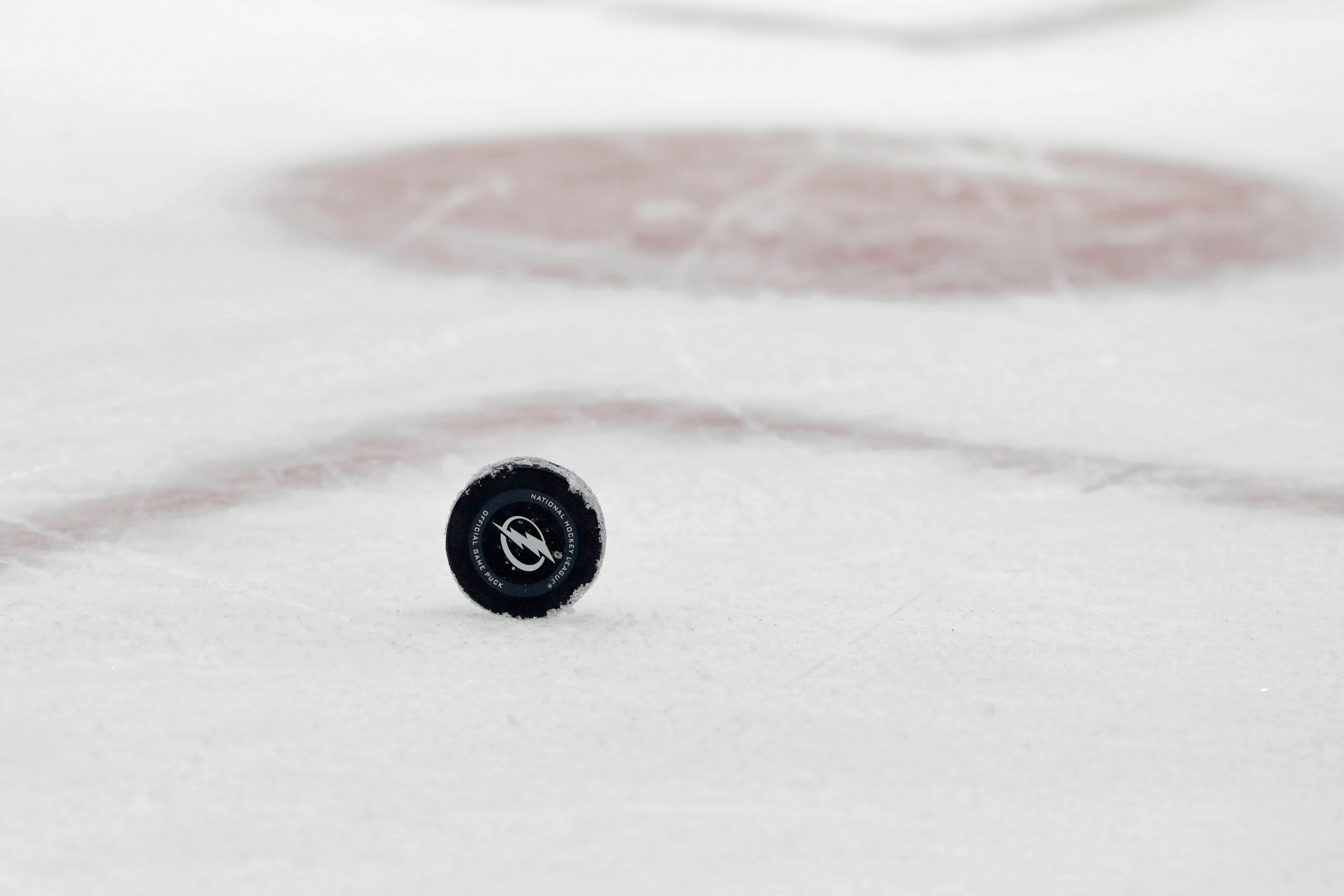 A hockey puck during the first period of an NHL hockey game between the Tampa Bay Lightning and the Ottawa Senators Tuesday, Dec. 17, 2019, in Tampa, Fla. (AP Photo/Chris O'Meara) A hockey puck during the first period of an NHL hockey game between the Tampa Bay Lightning and the Ottawa Senators Tuesday, Dec. 17, 2019, in Tampa, Fla. (AP Photo/Chris O'Meara)