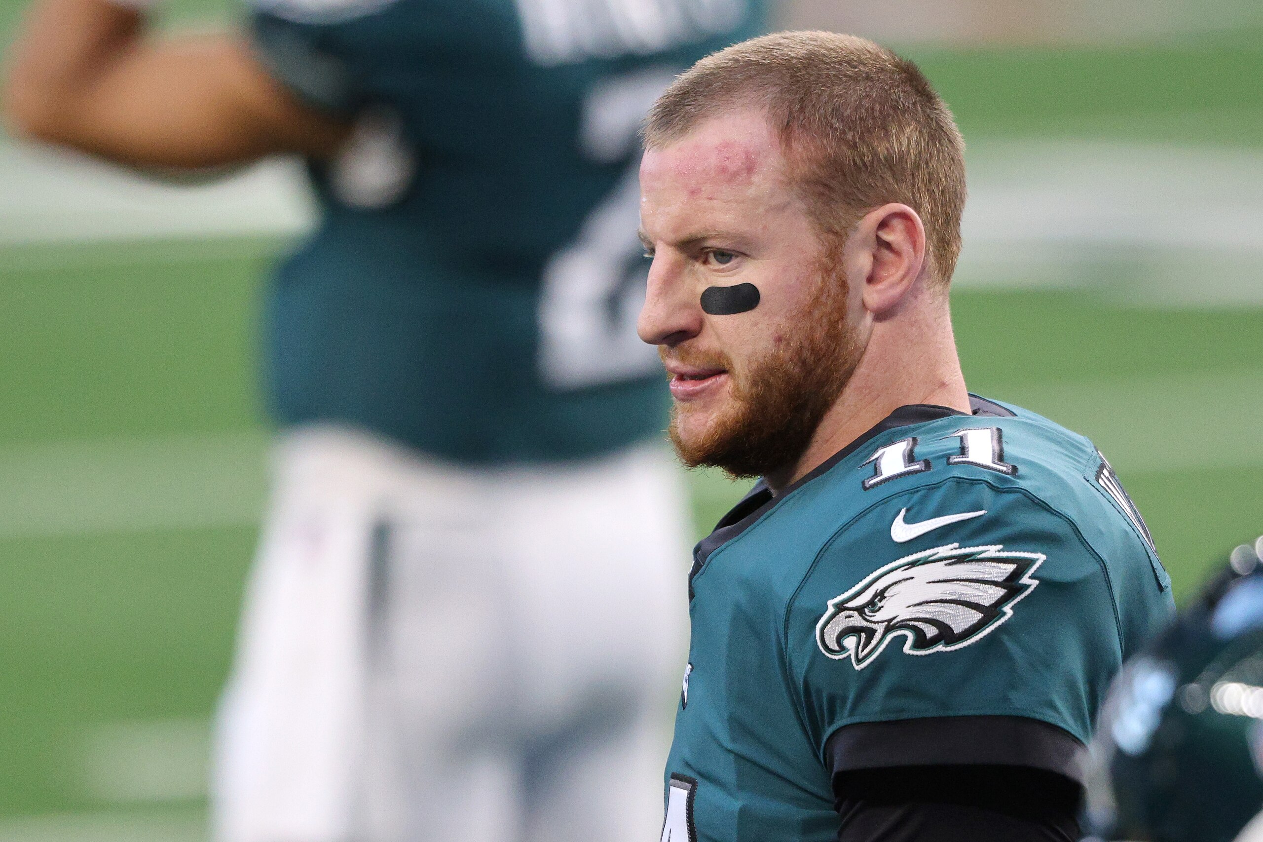 ARLINGTON, TEXAS - DECEMBER 27: Carson Wentz #11 of the Philadelphia Eagles looks on before the game against the Dallas Cowboys at AT&T Stadium on December 27, 2020 in Arlington, Texas. (Photo by Ronald Martinez/Getty Images)