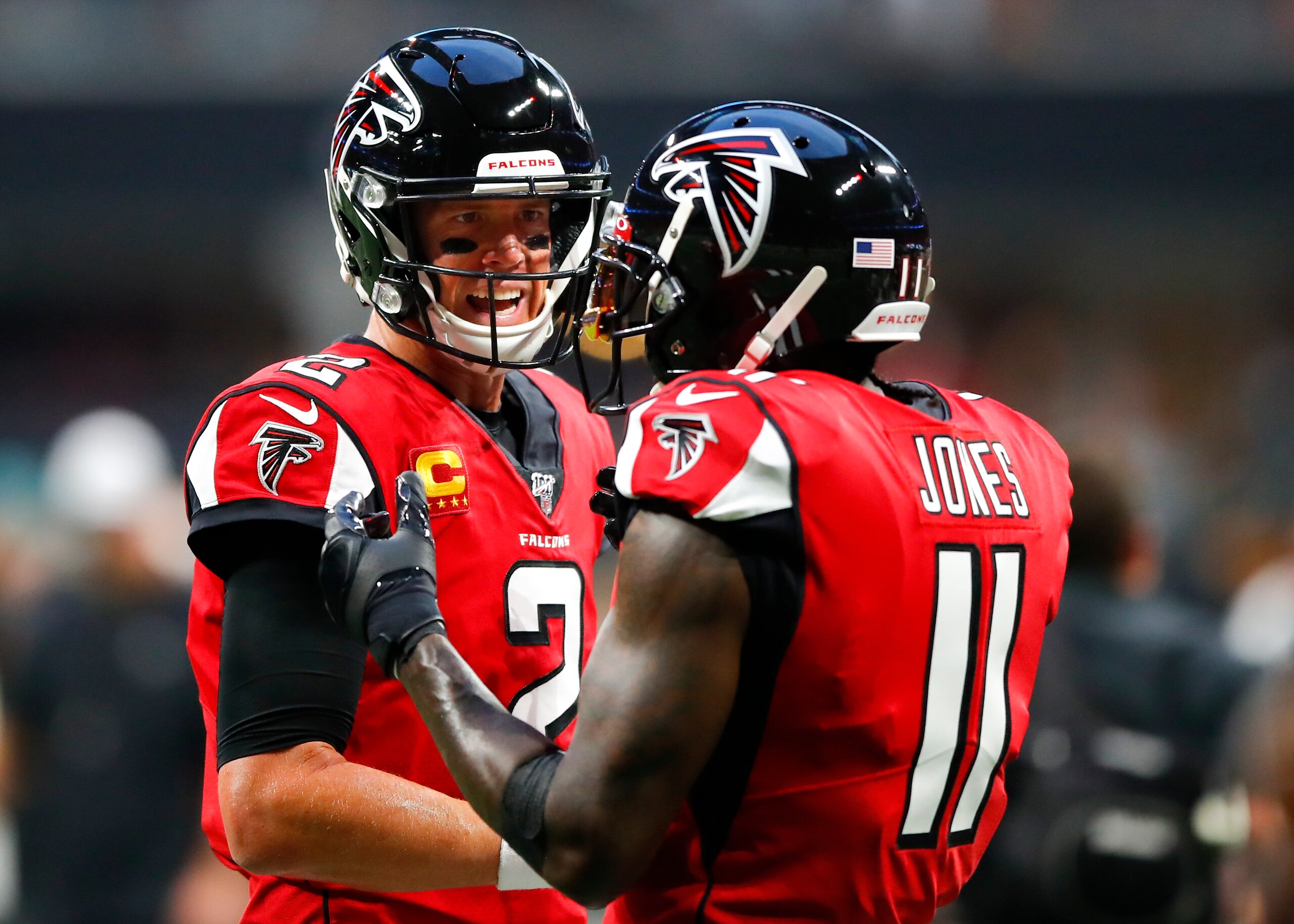 ATLANTA, GA - SEPTEMBER 15: Matt Ryan #2 of the Atlanta Falcons speaks with Julio Jones #11 prior to an NFL game against the Philadelphia Eagles at Mercedes-Benz Stadium on September 15, 2019 in Atlanta, Georgia. (Photo by Todd Kirkland/Getty Images)