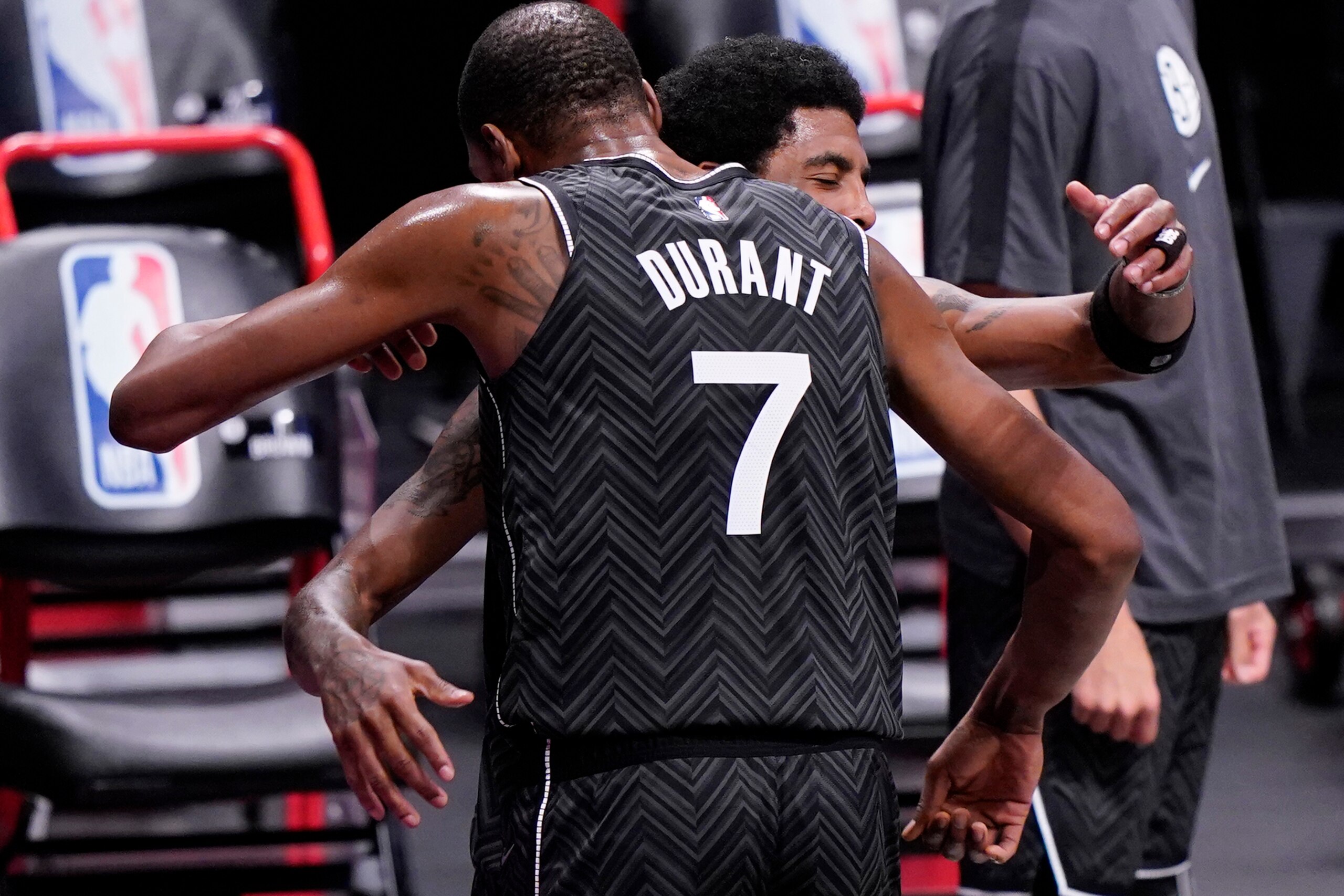 Brooklyn Nets forward Kevin Durant (7) embraces Nets guard Kyrie Irving after both during the fourth quarter of an NBA basketball game against the Phoenix Suns, Sunday, April 25, 2021, in New York. The Nets defeated the Suns 128-119. (AP Photo/Kathy Willens) Brooklyn Nets forward Kevin Durant (7) embraces Nets guard Kyrie Irving after both during the fourth quarter of an NBA basketball game against the Phoenix Suns, Sunday, April 25, 2021, in New York. The Nets defeated the Suns 128-119. (AP Photo/Kathy Willens)