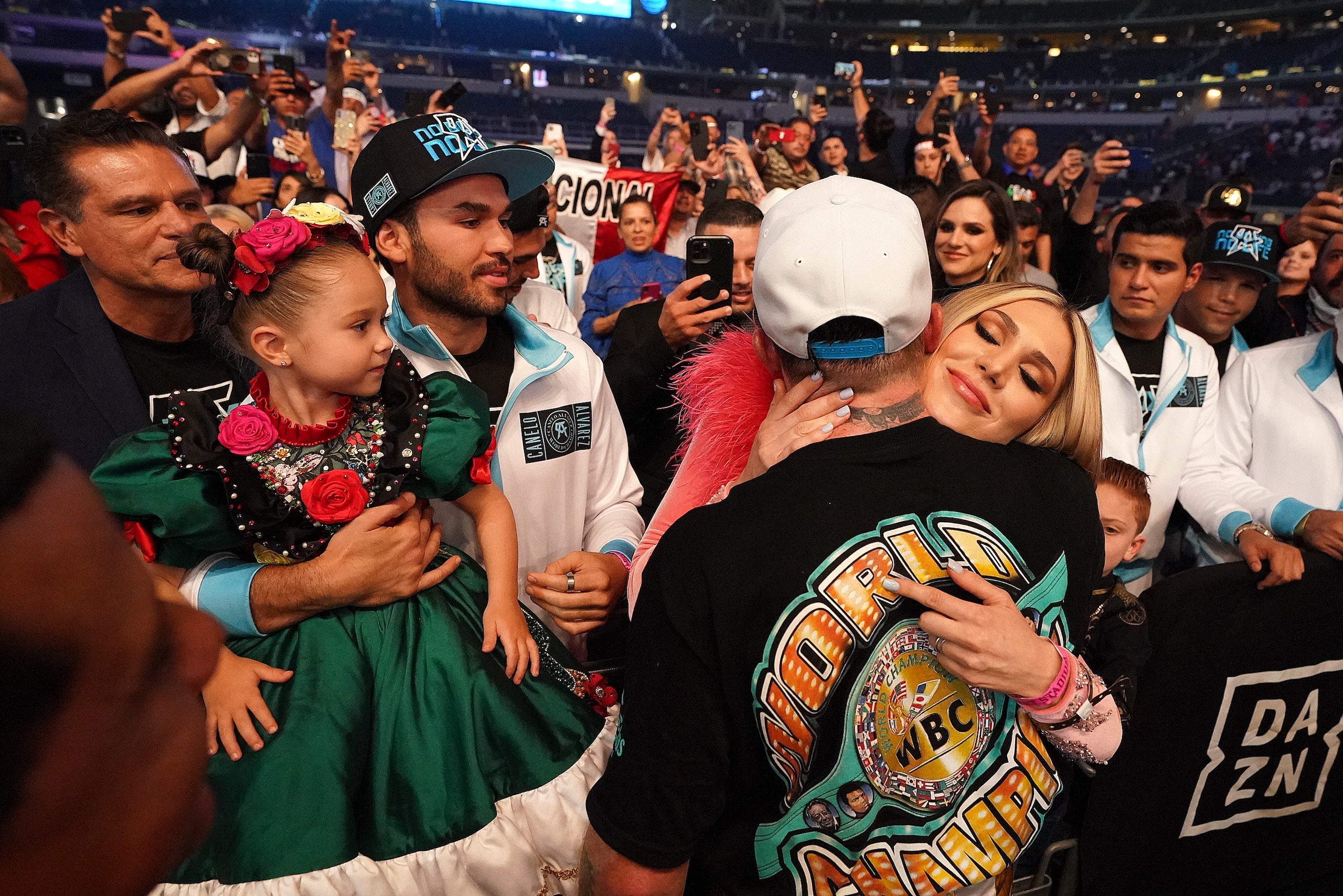 Canelo Alvarez hugs his girlfriend, Fernanda Gomez as their daughter, Maria, left, looks on, after defeating Billy Joe Saunders in a unified super middleweight world championship boxing match, Saturday, May 8, 2021, in Arlington, Texas. (AP Photo/Jeffrey McWhorter) Canelo Alvarez hugs his girlfriend, Fernanda Gomez as their daughter, Maria, left, looks on, after defeating Billy Joe Saunders in a unified super middleweight world championship boxing match, Saturday, May 8, 2021, in Arlington, Texas. (AP Photo/Jeffrey McWhorter)