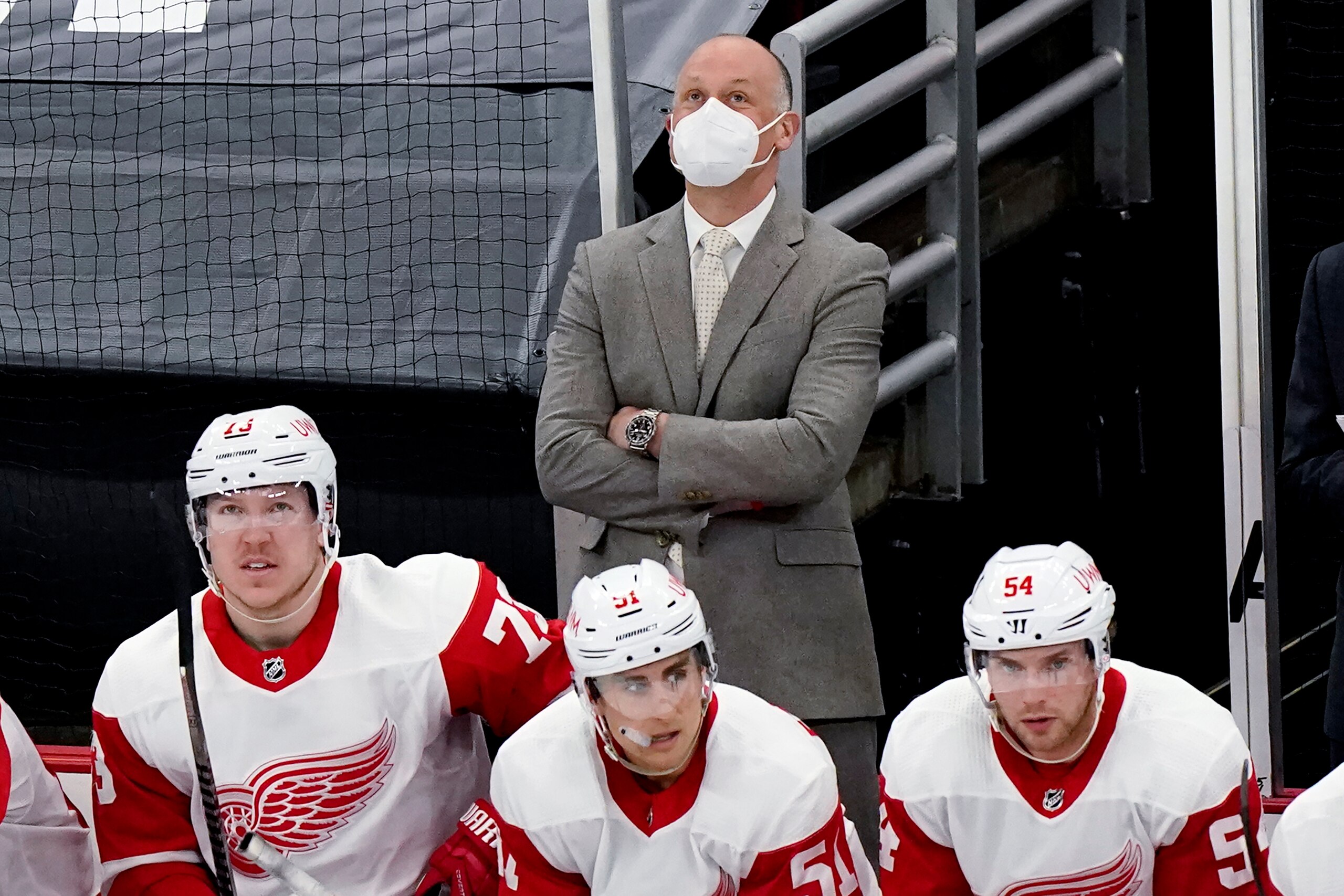 Detroit Red Wings head coach Jeff Blashill, top, looks up the scoreboard after Chicago Blackhawks' Ryan Carpenter scored his second goal during the third period of an NHL hockey game in Chicago, Sunday, Feb. 28, 2021. (AP Photo/Nam Y. Huh) Detroit Red Wings head coach Jeff Blashill, top, looks up the scoreboard after Chicago Blackhawks' Ryan Carpenter scored his second goal during the third period of an NHL hockey game in Chicago, Sunday, Feb. 28, 2021. (AP Photo/Nam Y. Huh)