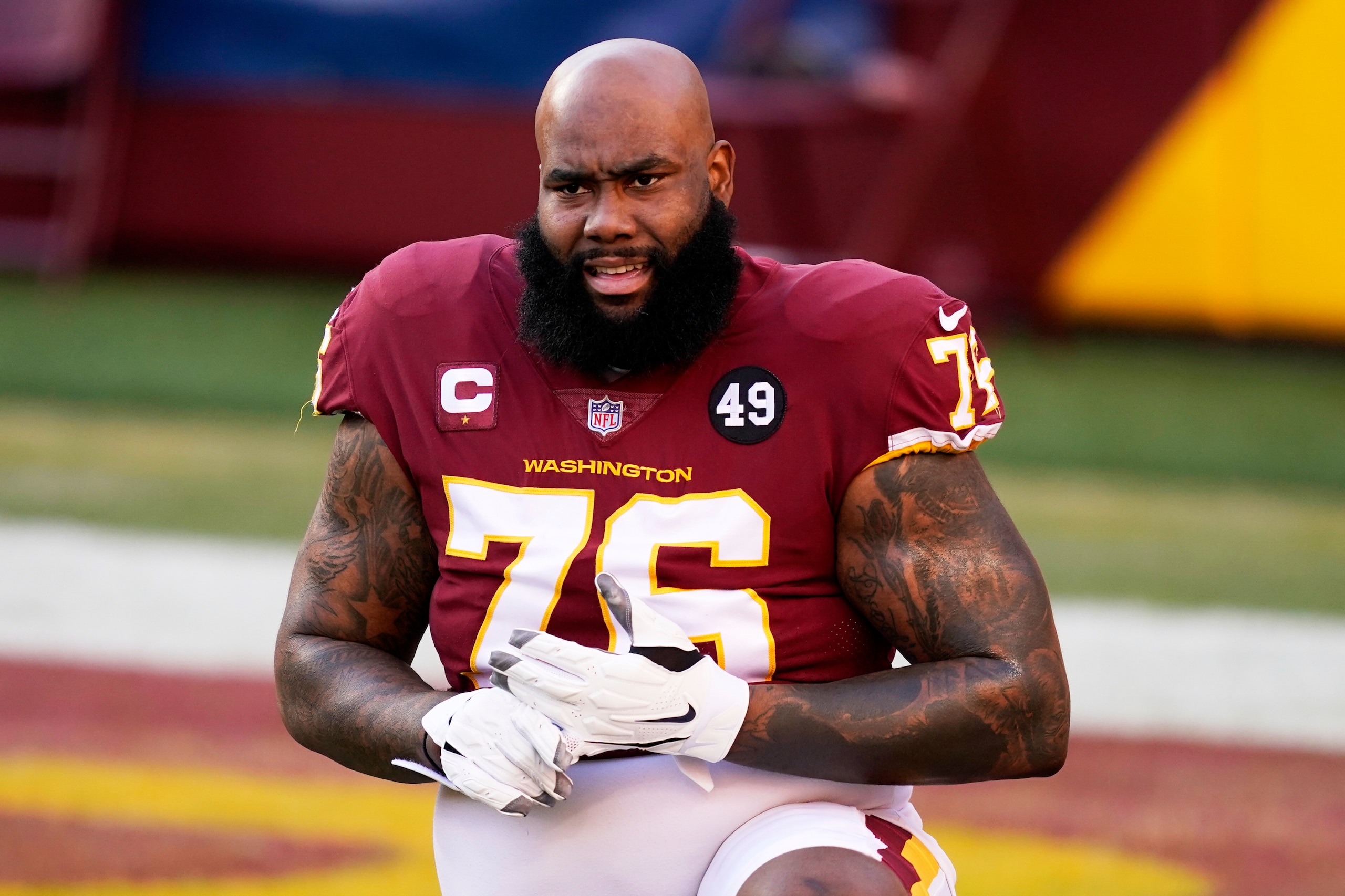 Washington Football Team offensive tackle Morgan Moses stretches prior to an NFL football game between the Carolina Panthers and the Washington Football Team, Sunday, Dec. 27, 2020, in Landover, Md. (AP Photo/Mark Tenally)