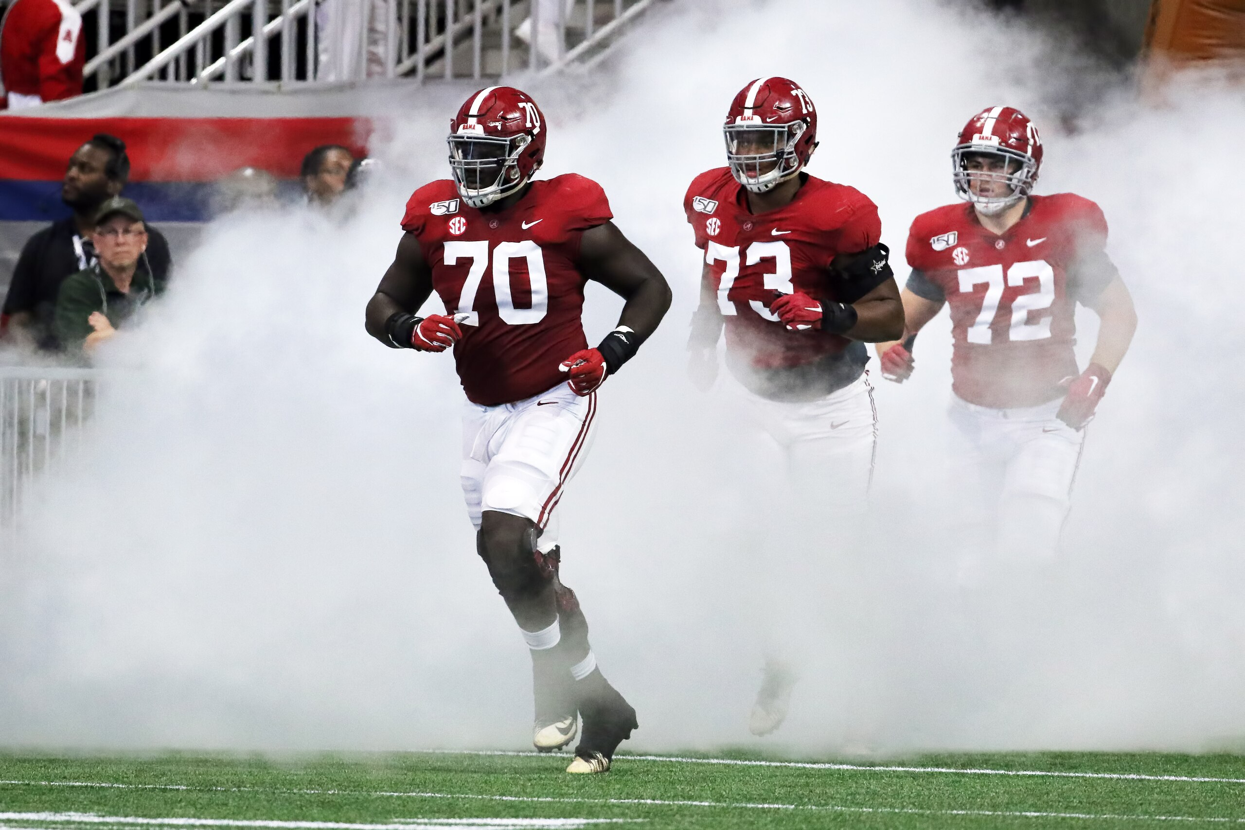 ATLANTA, GA - AUGUST 31:  Alabama Crimson Tide offensive lineman Alex Leatherwood (70), Alabama Crimson Tide offensive lineman Evan Neal (73) and Alabama Crimson Tide offensive lineman Pierce Quick (72) come out of the tunnel for the Chick-fil-A Kickoff Game between the Alabama Crimson Tide and the Duke Blue Devils on August 31, 2019 at Mercedes-Benz Stadium in Atlanta, Georgia.  (Photo by Michael Wade/Icon Sportswire via Getty Images)