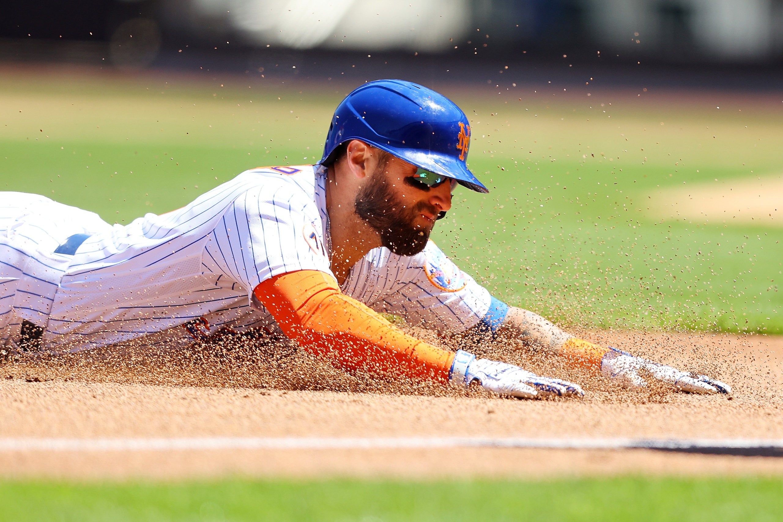 NEW YORK, NEW YORK - MAY 12: Kevin Pillar #11 of the New York Mets slides into third base after hitting a 2-run triple in the second inning against the Baltimore Orioles at Citi Field on May 12, 2021 in New York City. (Photo by Mike Stobe/Getty Images)