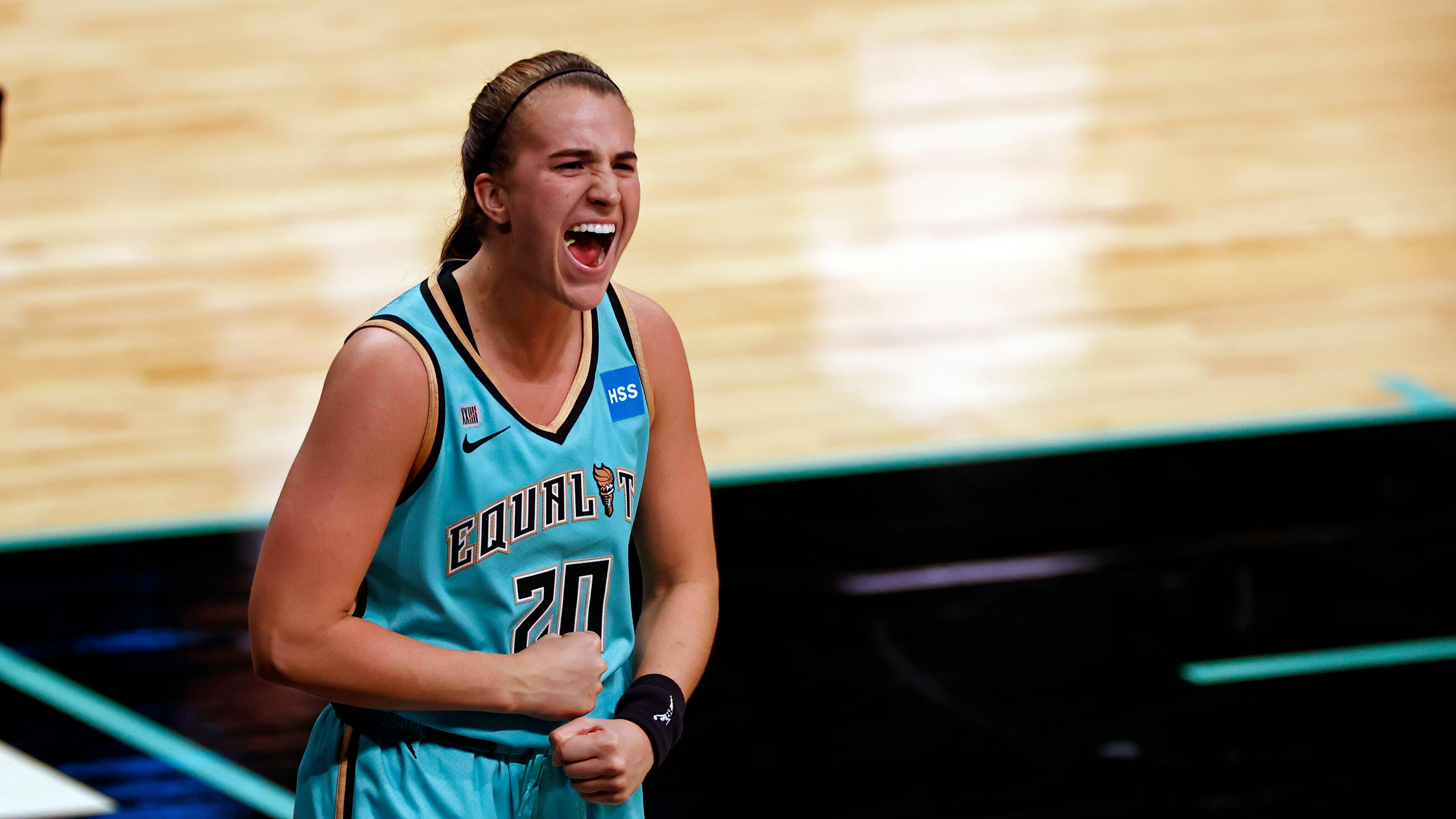 New York Liberty guard Sabrina Ionescu (20) reacts after making the game winning basket against the Indiana Fever during a WNBA basketball game, Friday, May 14, 2021, in New York. (AP Photo/Adam Hunger)