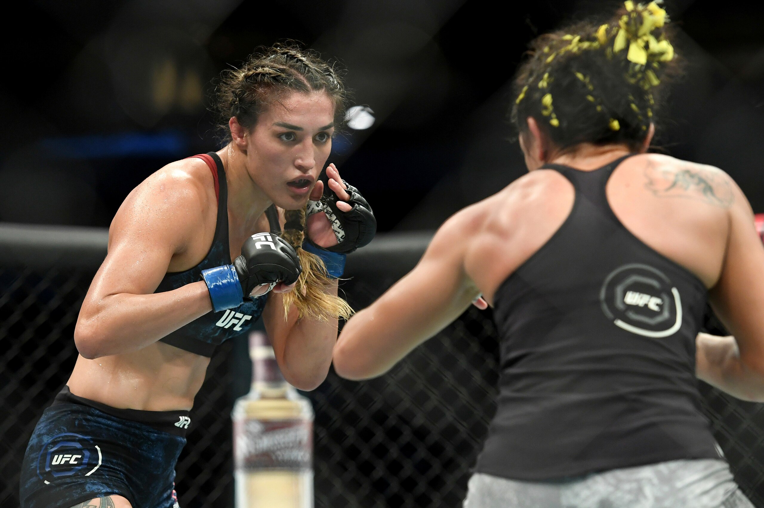Tatiana Suarez, left, spars with Carla Esparza during their strawweight mixed martial arts bout at UFC 228 on Saturday, Sept. 8, 2018, in Dallas. (AP Photo/Jeffrey McWhorter) Tatiana Suarez, left, spars with Carla Esparza during their strawweight mixed martial arts bout at UFC 228 on Saturday, Sept. 8, 2018, in Dallas. (AP Photo/Jeffrey McWhorter)