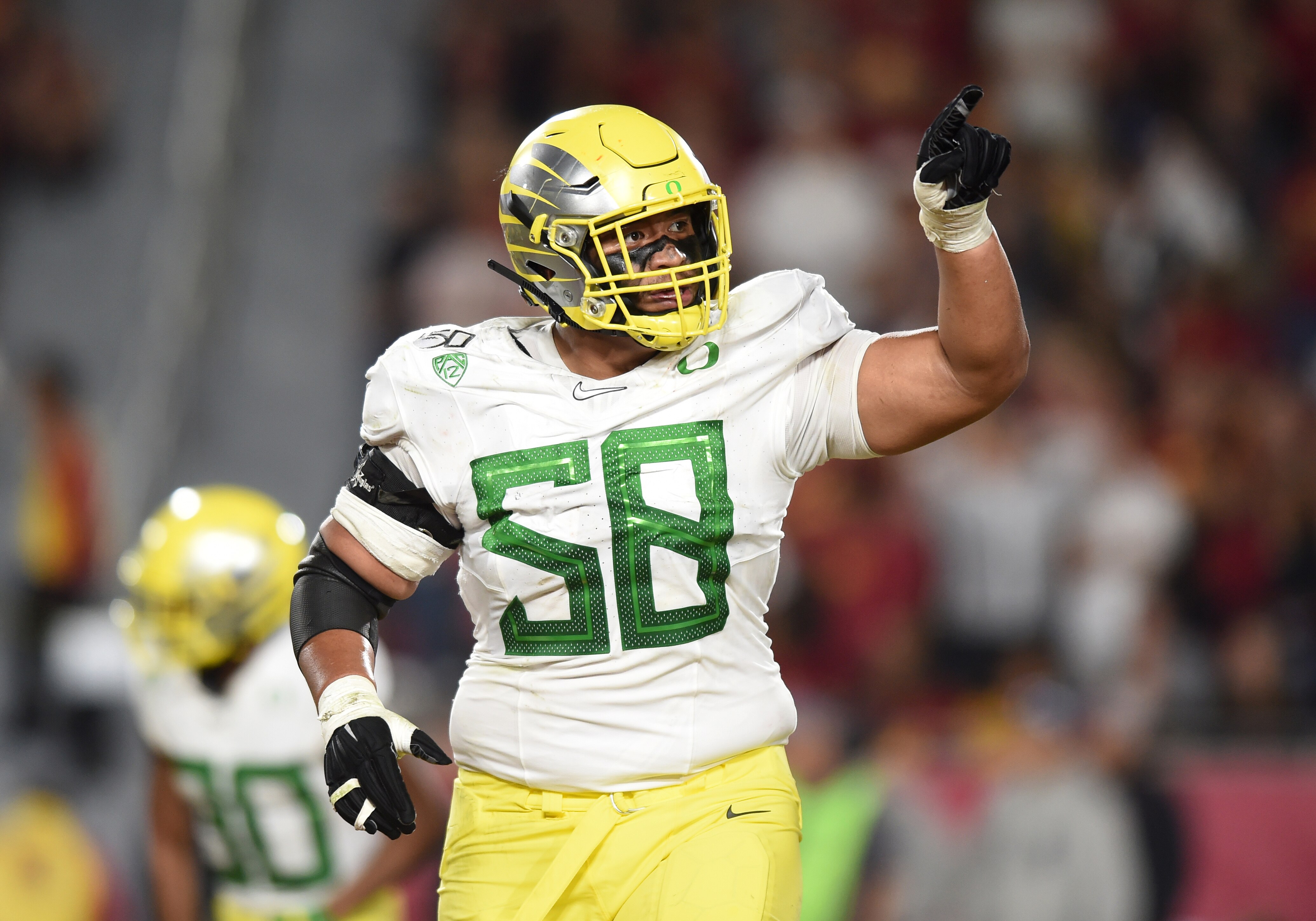 LOS ANGELES, CA - NOVEMBER 02: Oregon (58) Penei Sewell (OL) celebrates after an Oregon touchdwon during a college football game between the Oregon Ducks and the USC Trojans on November 02, 2019, at the Los Angeles Memorial Coliseum in Los Angeles, CA. (Photo by Chris Williams/Icon Sportswire via Getty Images)