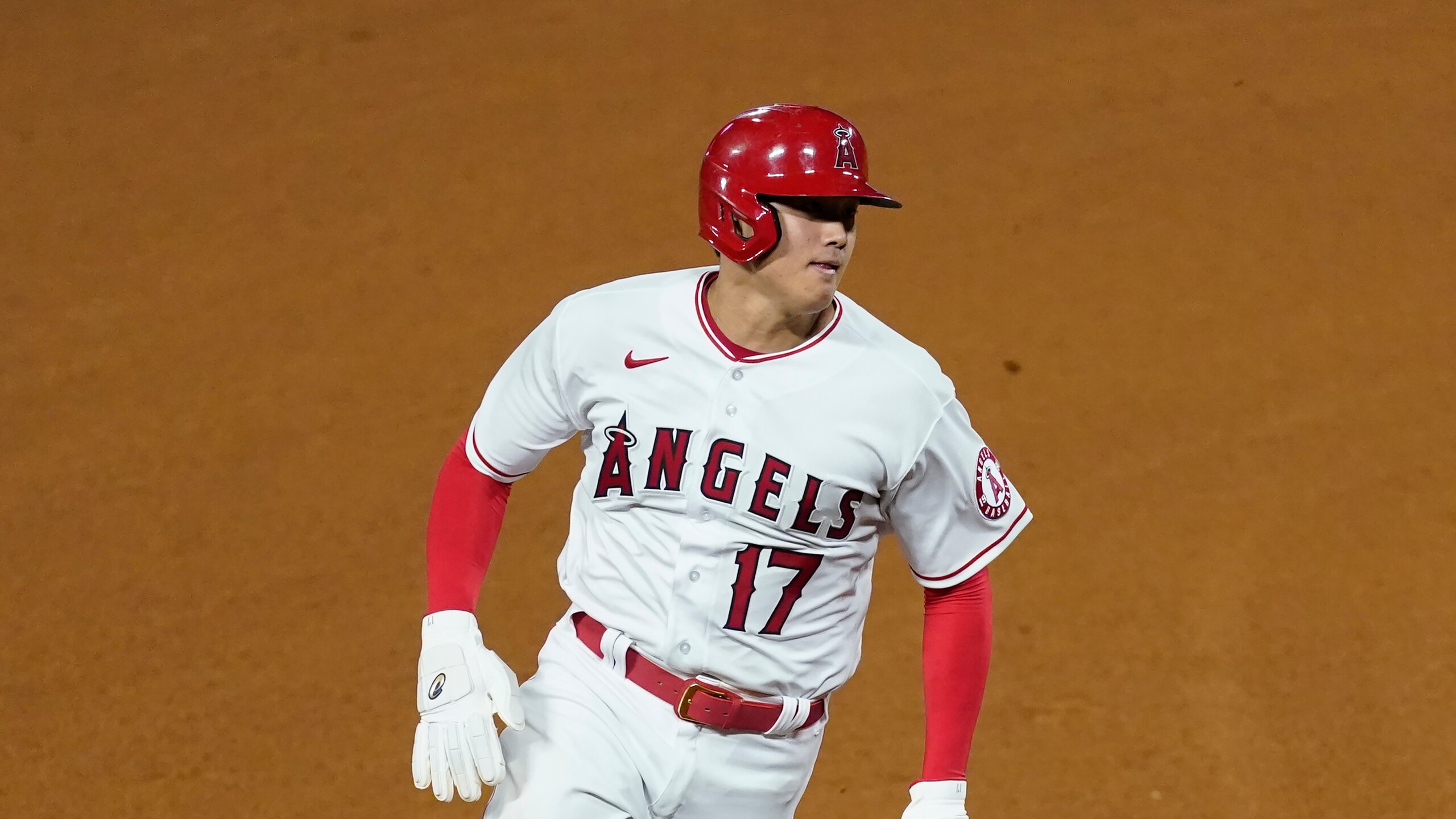 Los Angeles Angels designated hitter Shohei Ohtani (17) runs to third base during a baseball game against the Cleveland Indians Monday, May 17, 2021, in Anaheim, Calif. (AP Photo/Ashley Landis)