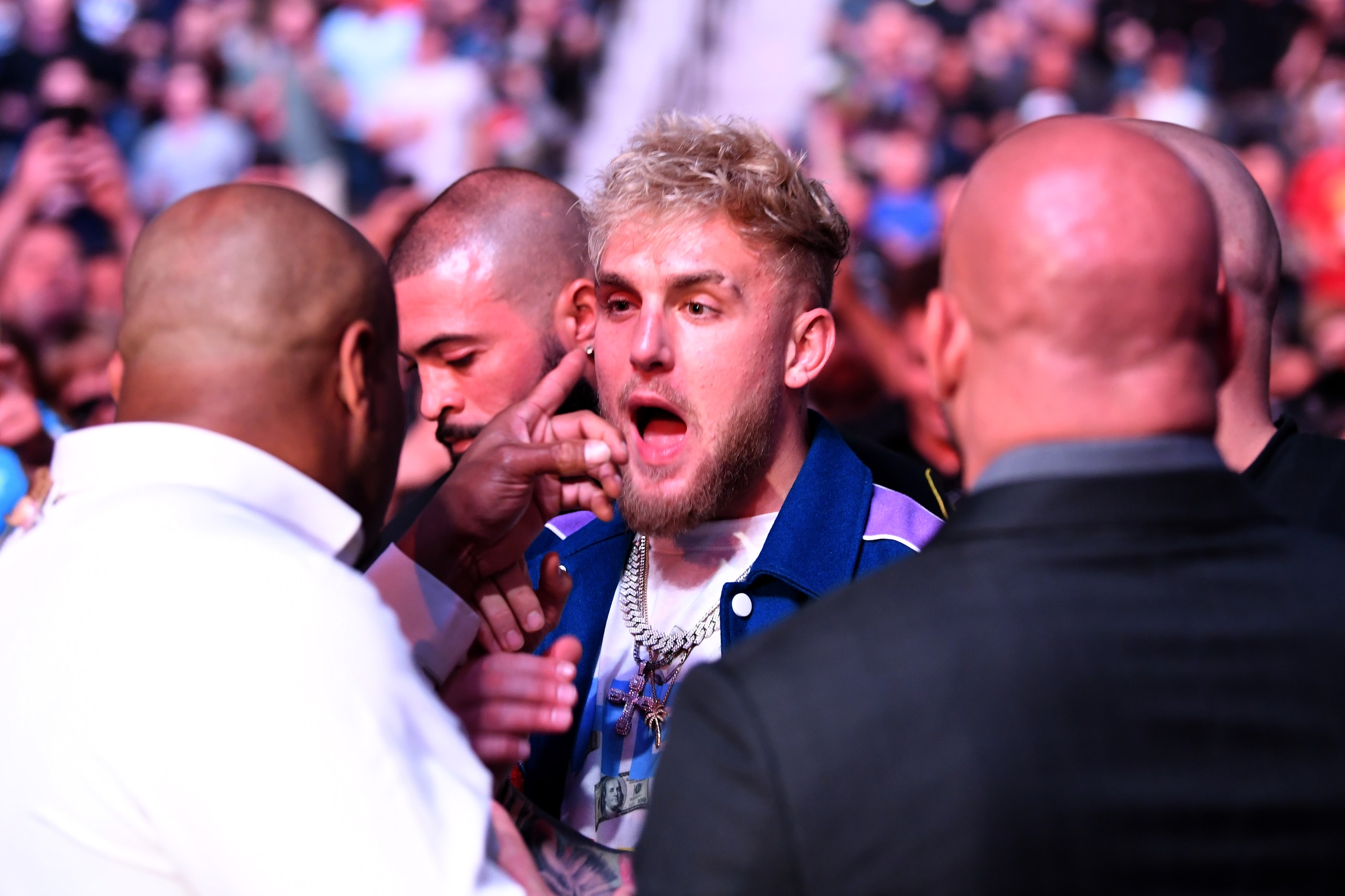 JACKSONVILLE, FLORIDA - APRIL 24: (L-R) Daniel Cormier interacts with Jake Paul during the UFC 261 event at VyStar Veterans Memorial Arena on April 24, 2021 in Jacksonville, Florida. (Photo by Josh Hedges/Zuffa LLC)